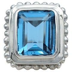 7.27 Carat Emerald Cut Blue Topaz Scalloped Edge Cocktail Ring in 14 Karat Gold