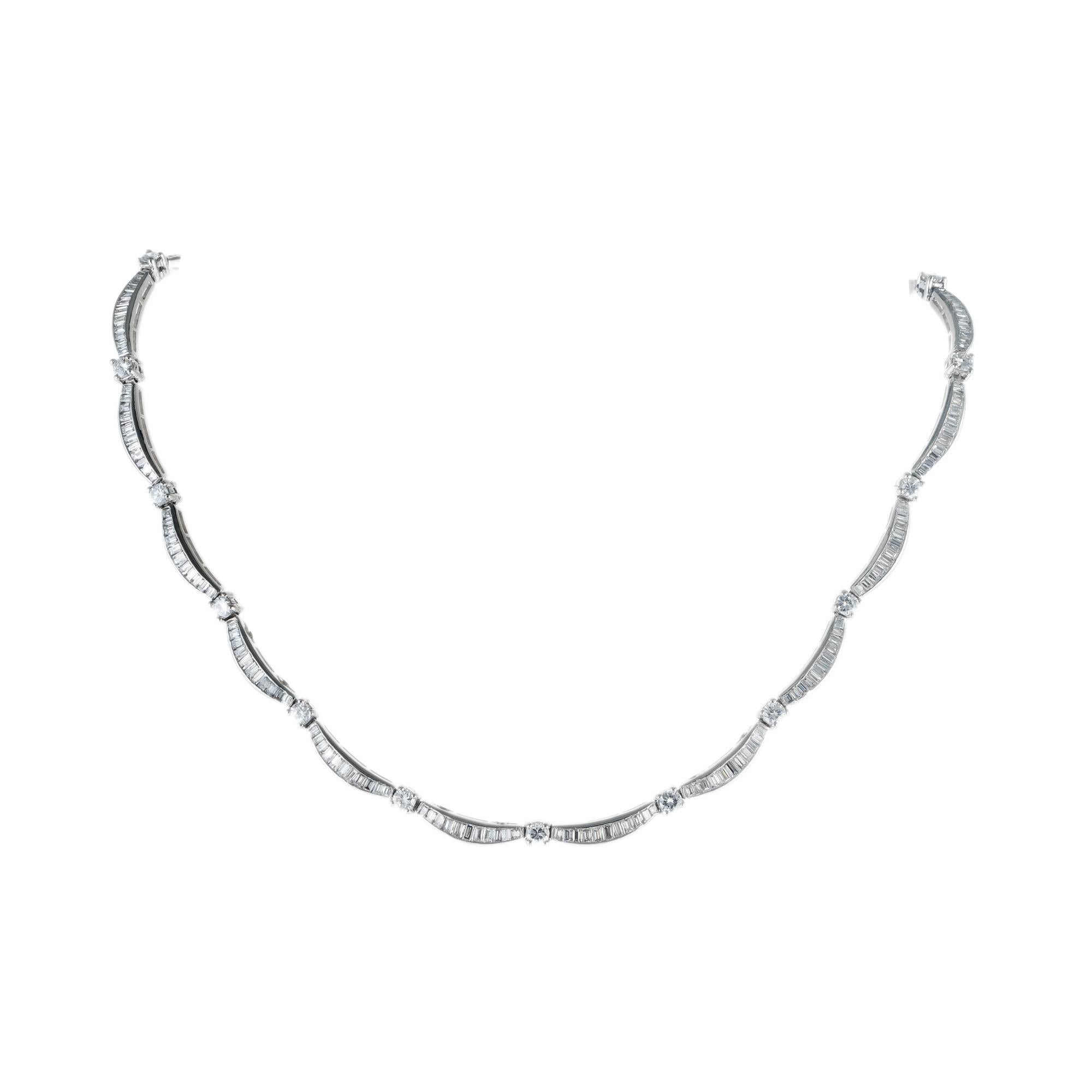 1950's diamond platinum necklace. 209 graduated straight baguettes separated by 19 round brilliant cut diamonds. Built in catch with underside safety. 15 inches long. 

19 round brilliant cut diamonds, G-H VS approx. 2.28cts
209 straight cut