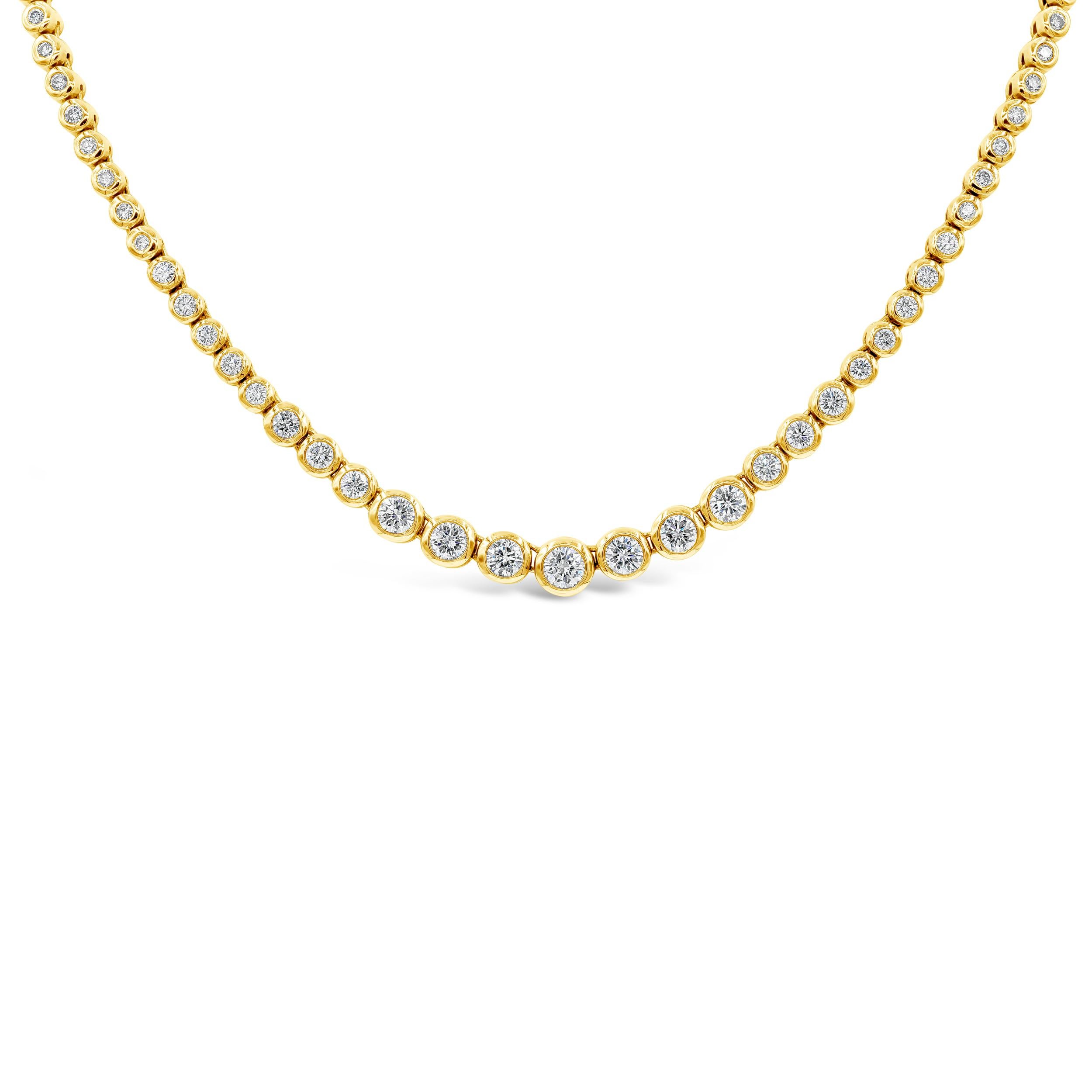 A simple riviere necklace perfect for everyday wear. Showcases graduating round brilliant diamonds elegantly set in a bezel mounting made in 14 karat yellow gold. Diamonds weigh 7.10 carats total and are approximately F-G color, VS-SI clarity.