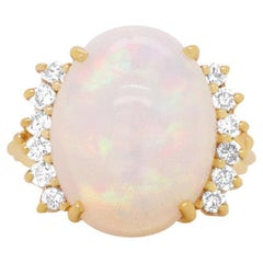 7.29 Carat Oval Shape Opal Round Accenting Diamonds Fashion Ring 14k Yellow Gold