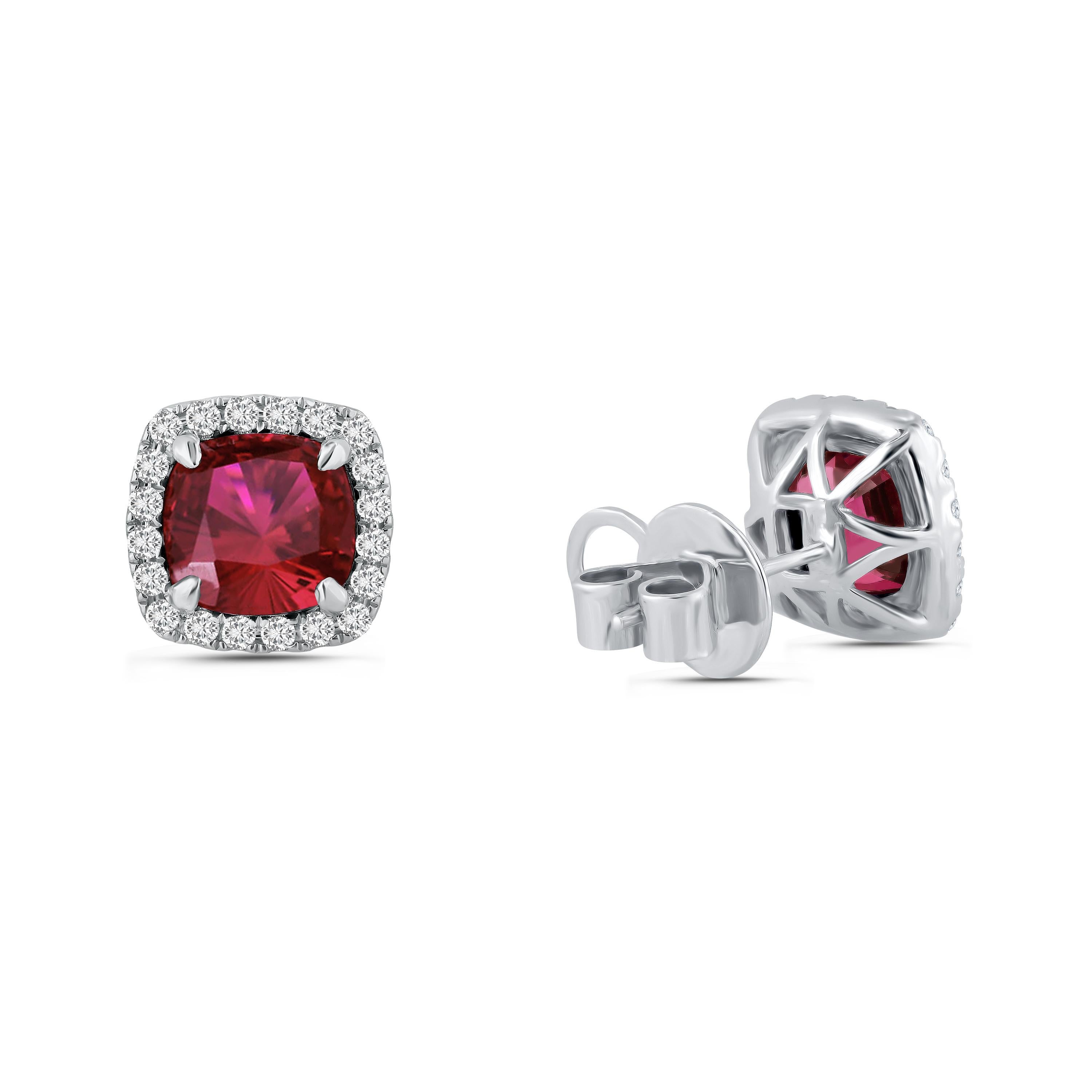 Introducing a pair of stud earrings that redefine the meaning of elegance and sophistication. These exquisite earrings are adorned with stunning 7.29 carats of cushion-cut garnet centers, their deep and alluring red hues exuding a sense of timeless