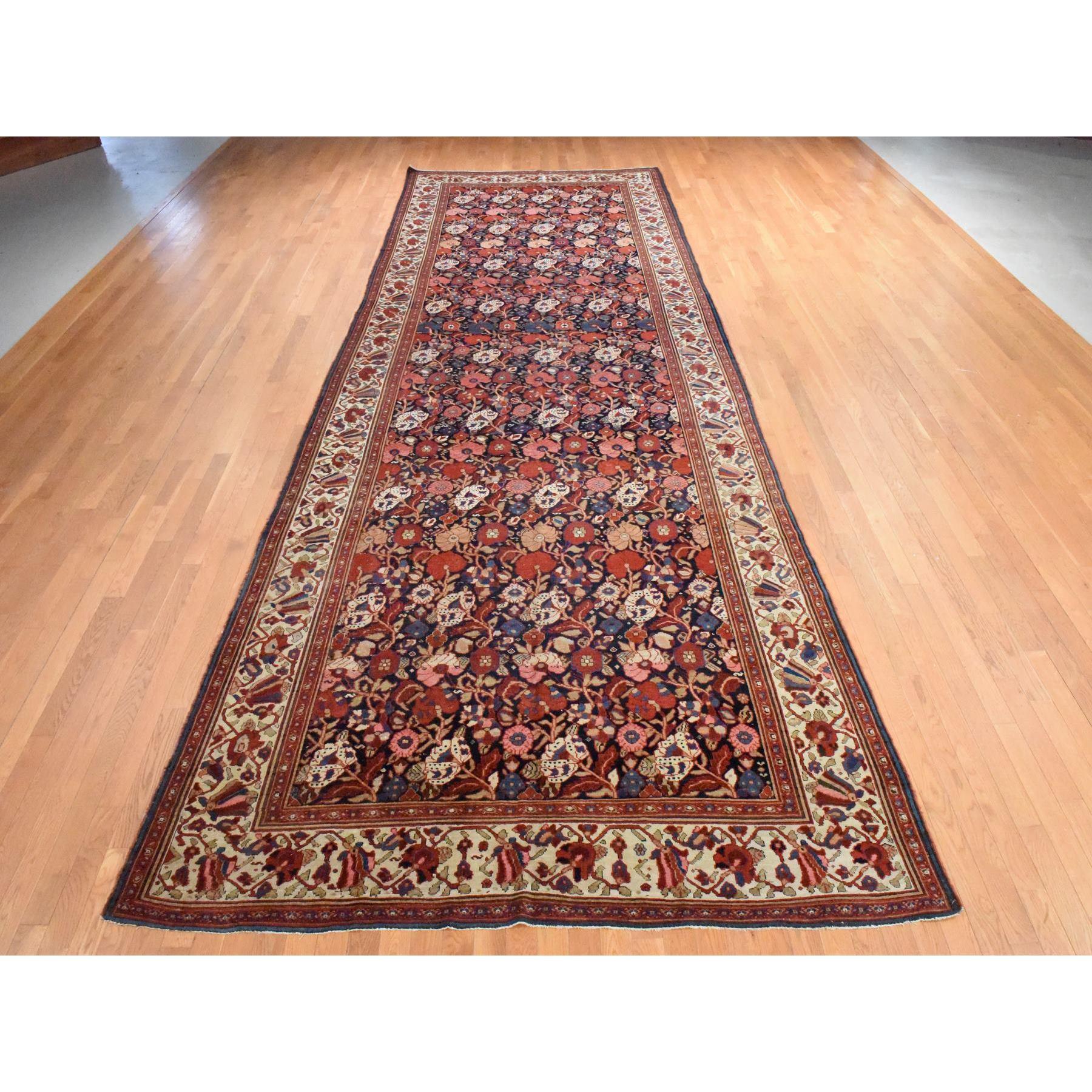 Midnight Blue, Repetitive Botanical Design, Gallery Size, Hand Knotted, 100% Wool, XL, Oriental Rug
Primary materials: Wool
Latex: No Pile 
height: 0.25 Inches
Style: Traditional
Primary color: Blue
Secondary colors: Red, Peach, Gray, Beige,