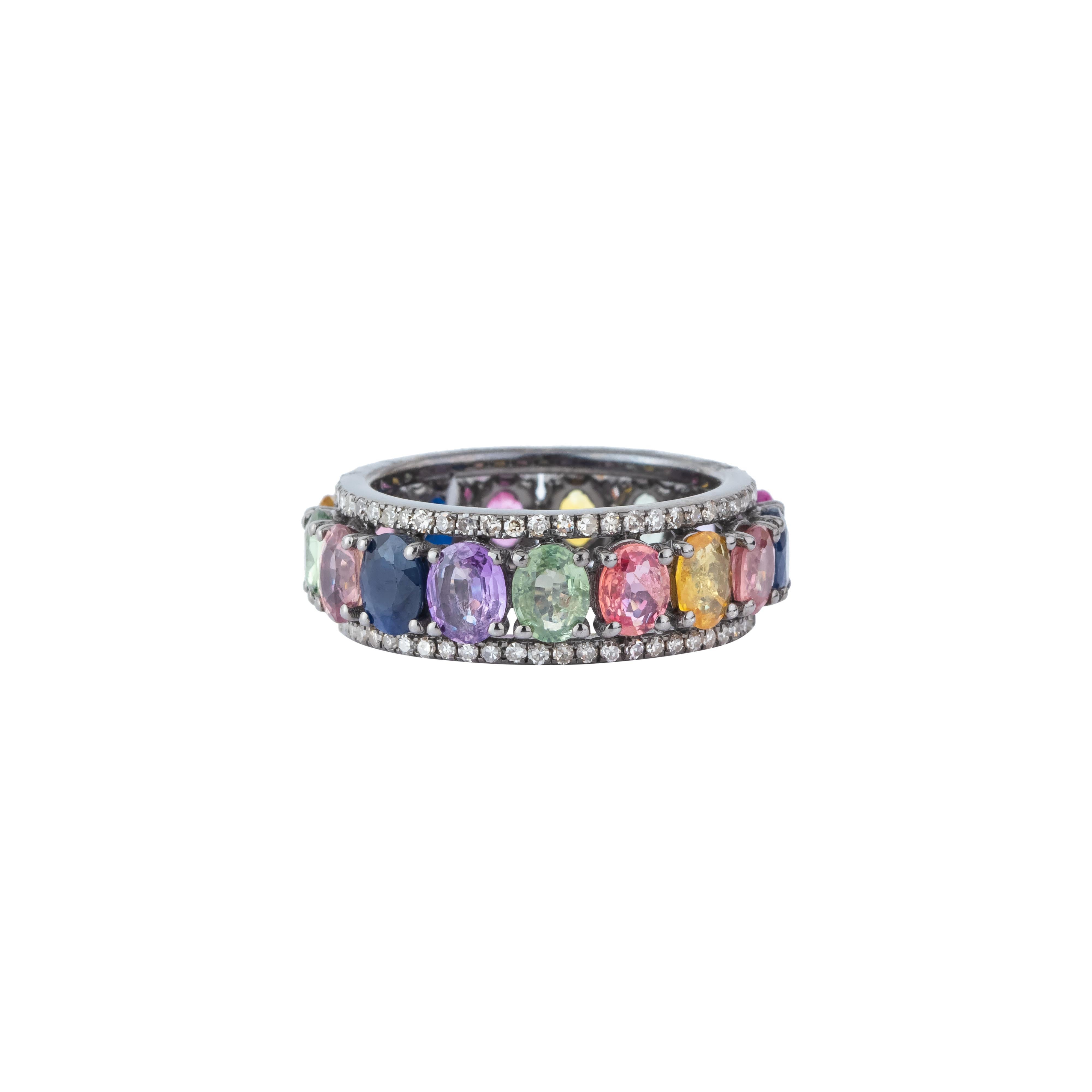 The 7.3 Carat Diamond and Multi Sapphire Eternity Ring is a masterful creation that seamlessly blends opulence with vibrant color. This exquisite band features a continuous circle of alternating diamonds and multi-colored sapphires, each set to
