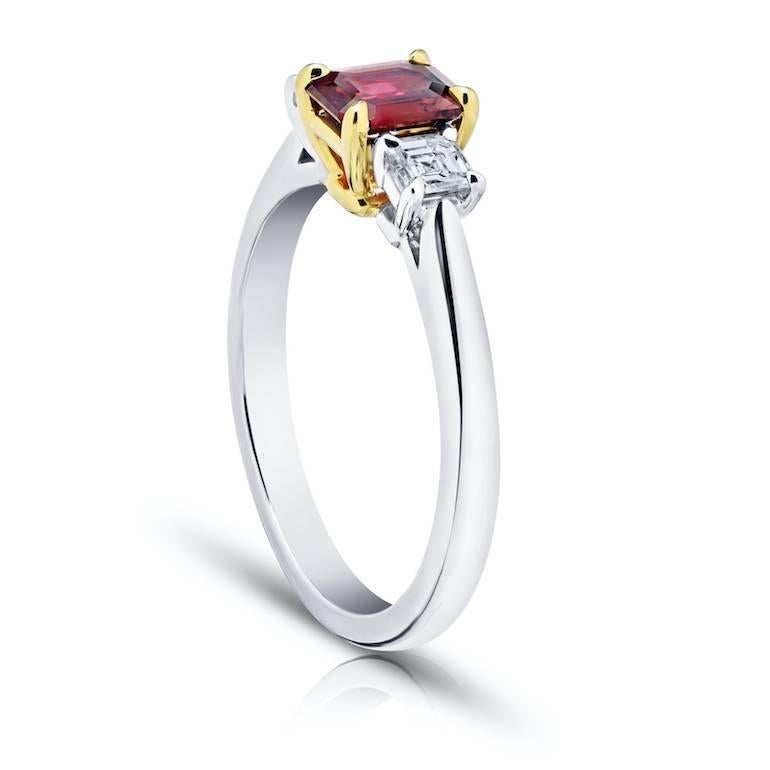 .73 Carat Emerald Cut (natural no heat) Red Ruby with 2 Asscher cut diamonds .39 carats set in a platinum and 18k yellow gold ring.
