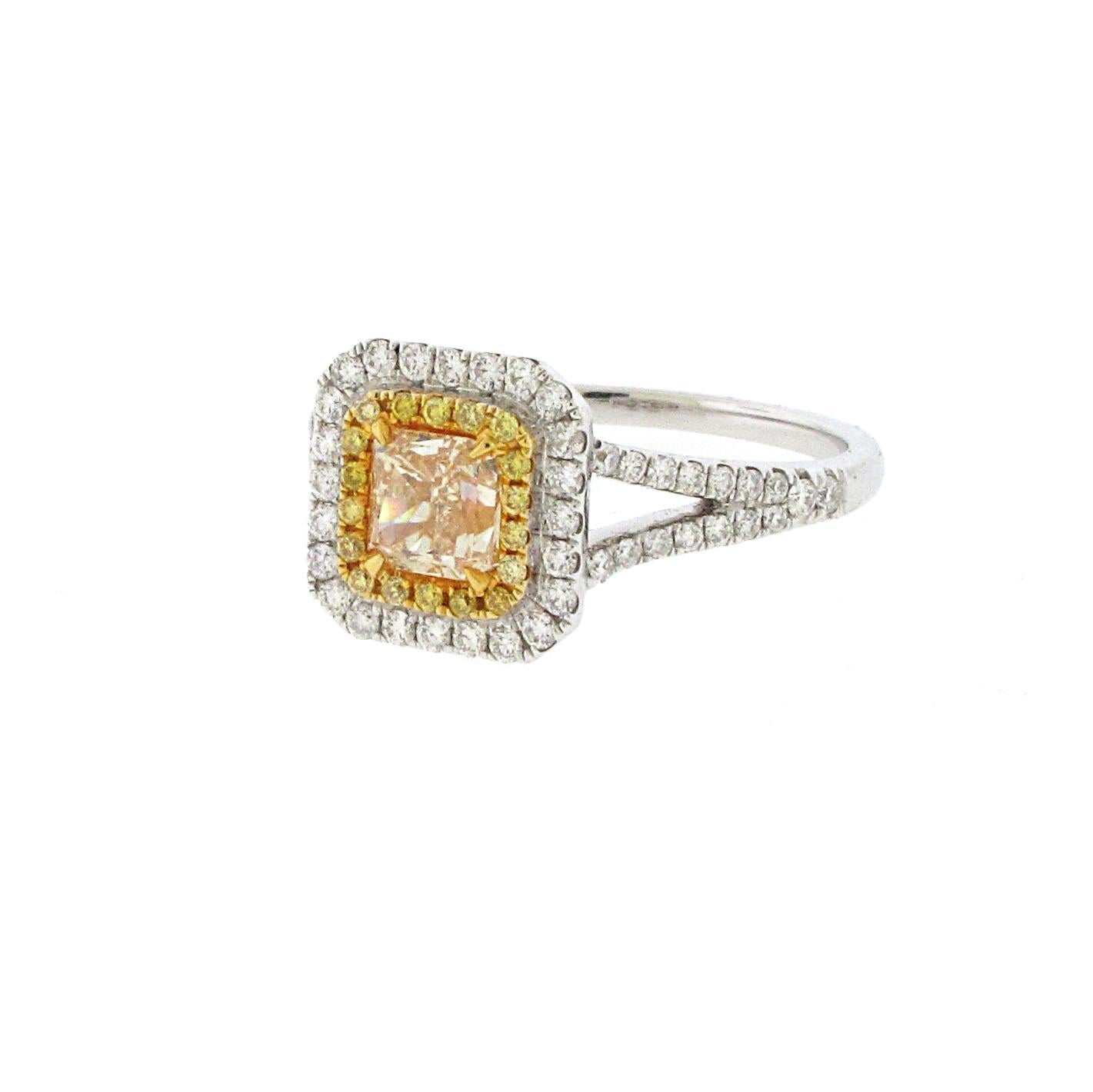 This is a huge looking ring for not a huge amount of money. Almost a 1ct center yellow diamond set in a double halo with yellow and white diamonds. The halo ring is the most popular setting style these days and yellow diamonds are making a big