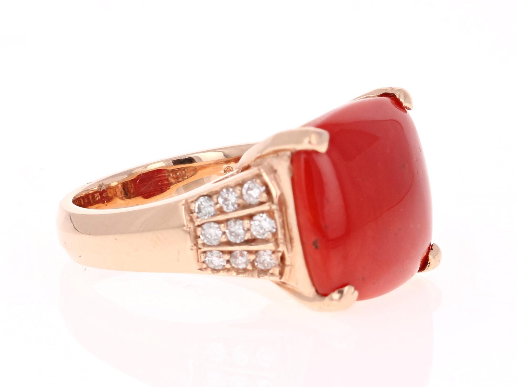 A stunning Coral and Diamond Cocktail Ring! 

This one of a kind beauty has a magnificent 6.90 Carat Square Cushion Cut Coral. It is further embellished with 18 Round Cut Diamonds that weigh 0.40 Carats.  The total carat weight of the ring is 7.30