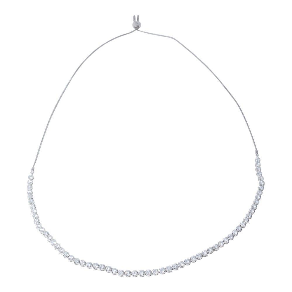 14k white gold necklace containing 7.30 carats of prong set diamonds. The color and clarity grades of the diamonds contained within the necklace are E-F, VS1-SI1, respectively. The average polish, symmetry, and cut grade for each of these diamonds