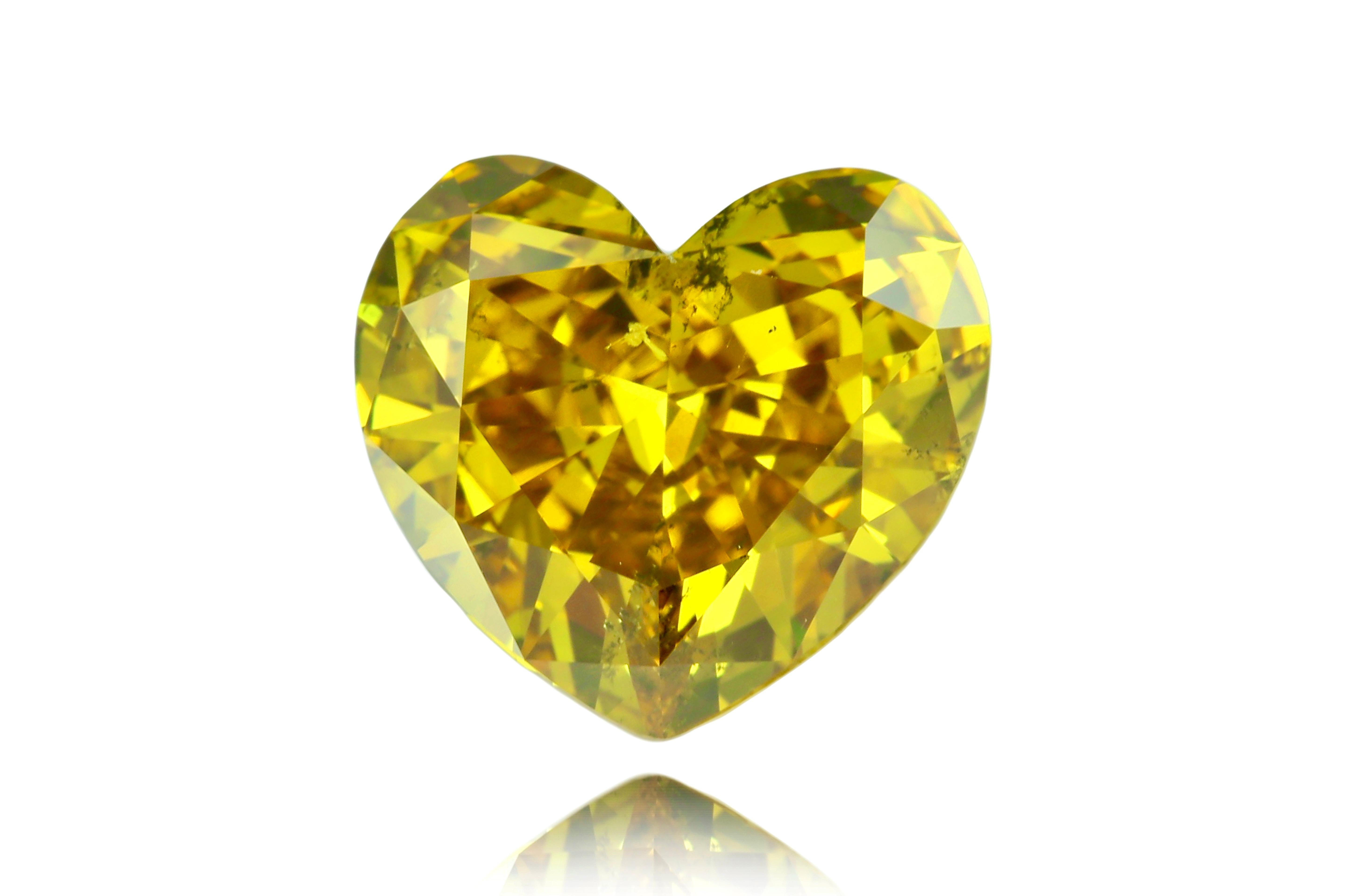 Introducing the Exquisite 7.30 Carat Heart Shape Diamond in Fancy Deep Brownish Greenish Yellow:

Elegance meets rarity in this stunning 7.30-carat heart-shaped diamond, a true masterpiece of nature. Boasting a mesmerizing Fancy Deep Brownish