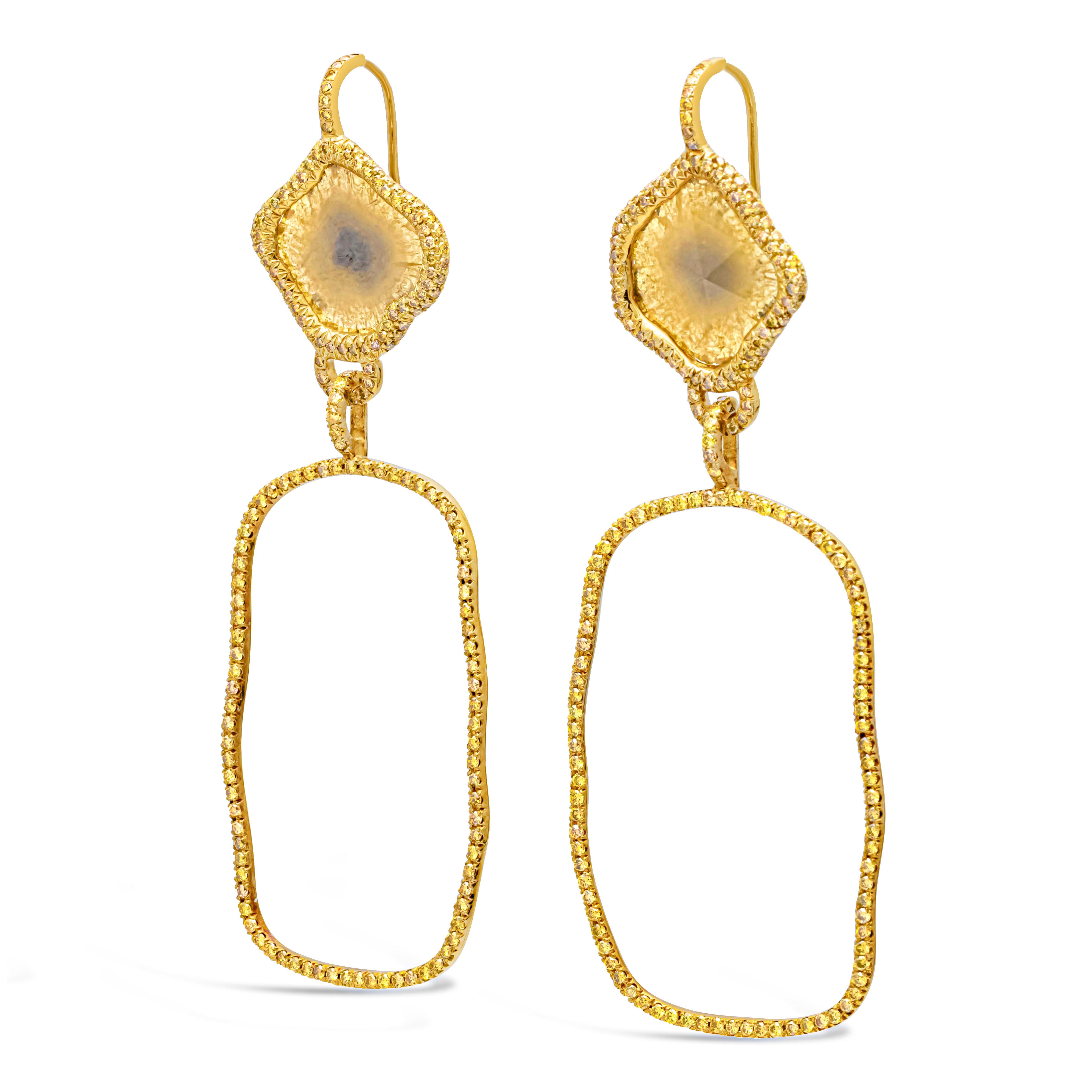 Showcasing a beautiful, special and intricately-designed pair of dangle earrings set with yellow brown diamond slices weighing 3.10 carats total and 376 brilliant round yellowish diamonds weighing 4.20 carats total, SI in clarity. Finely made in 18k