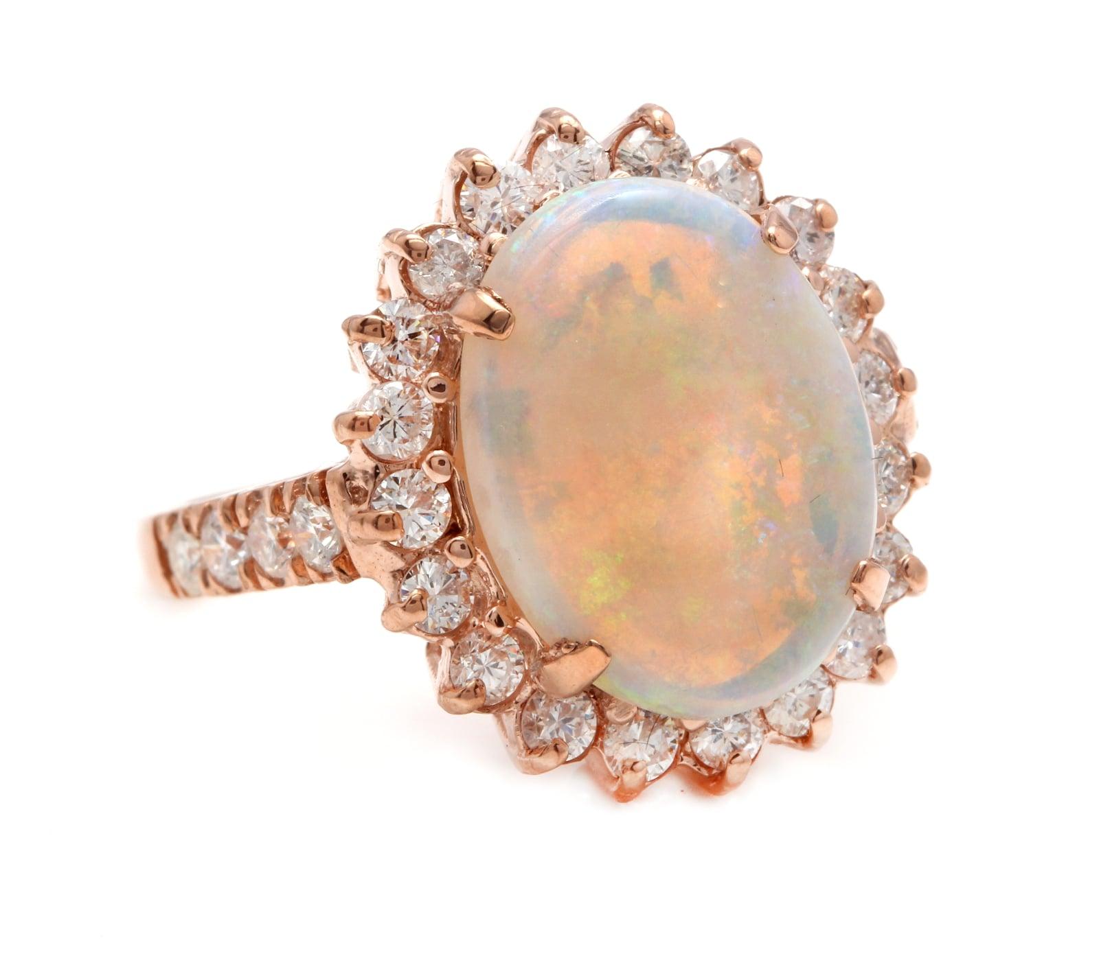 7.10 Carats Natural Impressive Australian Opal and Diamond 14K Solid Rose Gold Ring

Amazing play of colors opal. Pictures don't show the beauty of the opal.

Total Natural Opal Weight is: Approx. 6.00 Carats

Opal Measures: Approx. 14.00 x