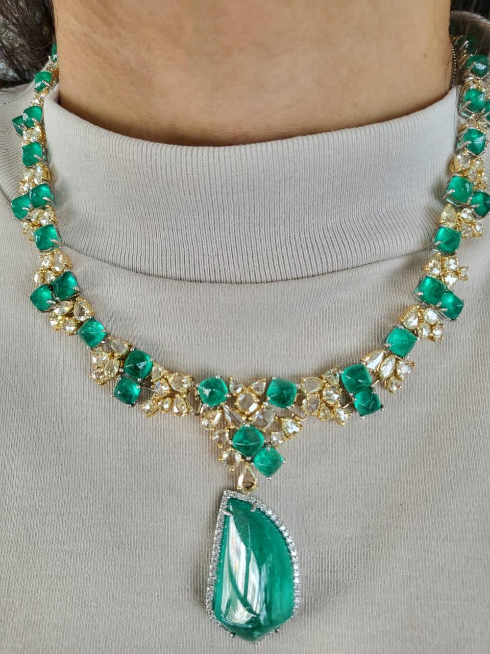 A very gorgeous and one of a kind, Emerald Choker Drop Necklace set in 18K Gold & Diamonds. The weight of the Emerald Sugarloafs is 36.74 carats. The Emeralds are completely natural, without any treatment and is of Columbian origin. The weight of
