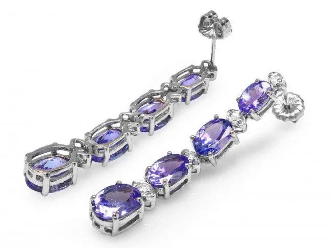 7.30Ct Natural Tanzanite and Diamond 14K Solid White Gold Earrings

Total Natural Oval Tanzanite Weight: 6.90 Carats

Tanzanite Measures: 6 x 4 - 7 x 5 - 8 x 6 mm

Total Natural Round Cut White Diamonds Weight: Approx. 0.40 Carats (color G-H /