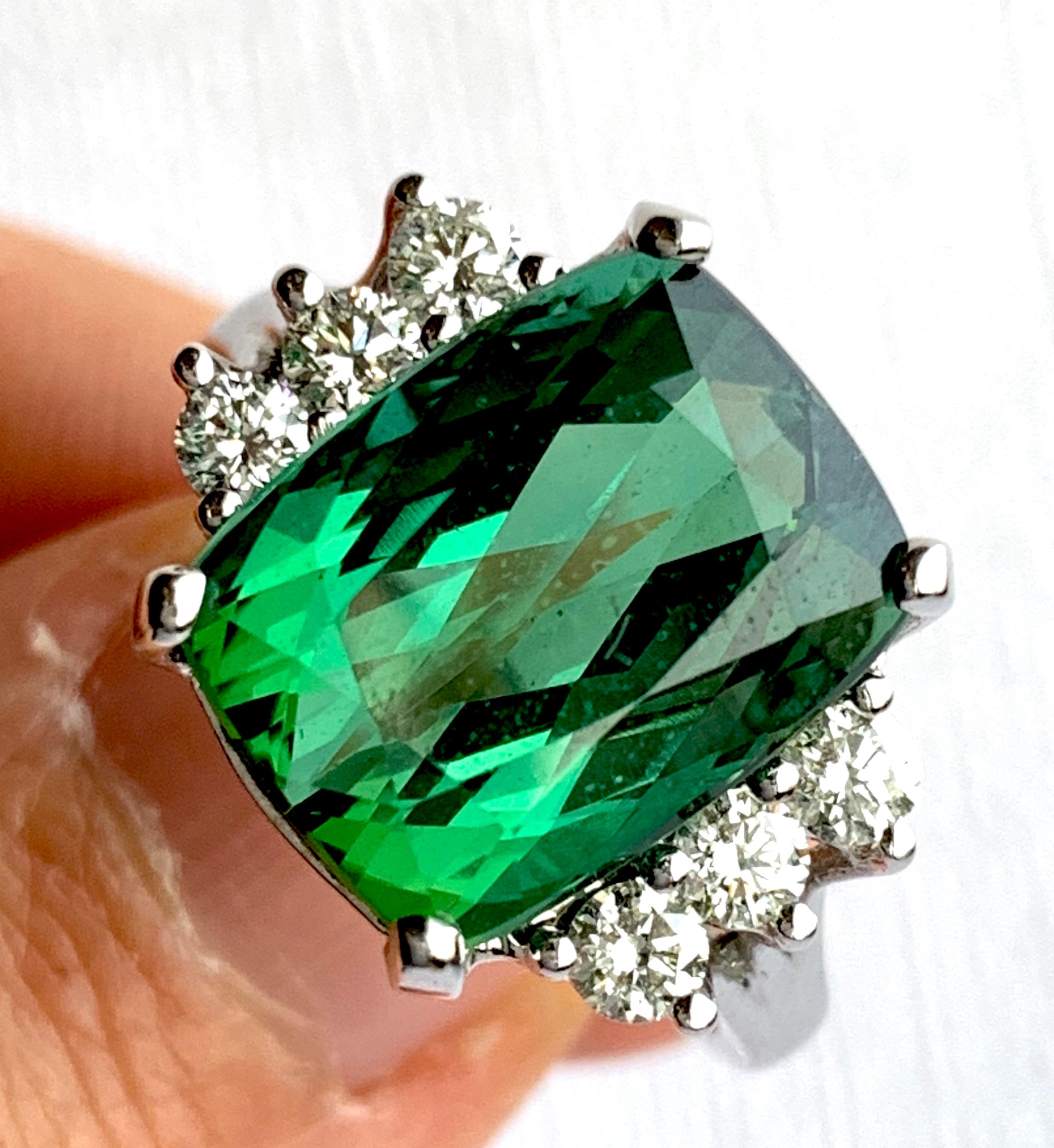 Material: 14k White Gold 
Center Stone Details: 7.31 Carat Cushion Green Tourmaline - Measuring 12.7 x 9.9 mm
Mounting Diamond Details: 6 Round White Diamonds Approximately 0.46 Carats - Clarity: SI / Color: H-I
Ring Size: Size 6.5. Alberto offers