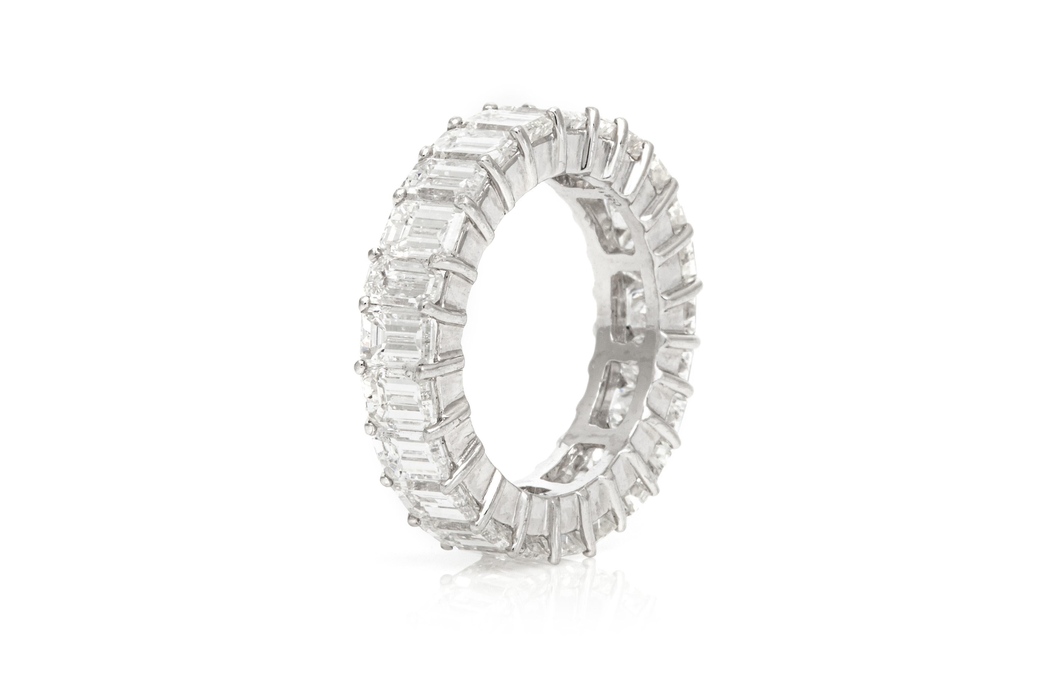 Finely crafted in platinum with 24 Emerald cut Diamonds weighing a total of approximately 7.32 carats, H color, VS1-VS2 clarity.
5mm wide
Size 6