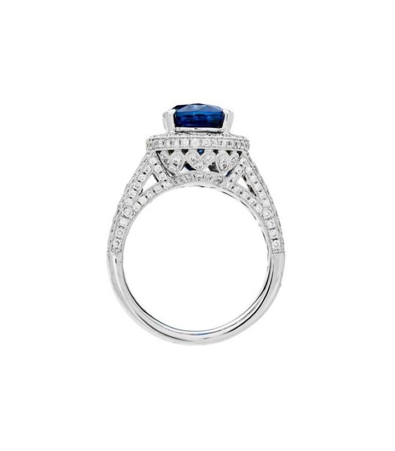One of a kind 7.32 Carat Oval Cut Ceylon Sapphire and Diamonds in Gold.

*RING* One exclusive AMORO eighteen karat white gold blue Ceylon Sapphire and Diamond ring featuring; one heart prong oval cut genuine Ceylon Sapphire weighing approximately