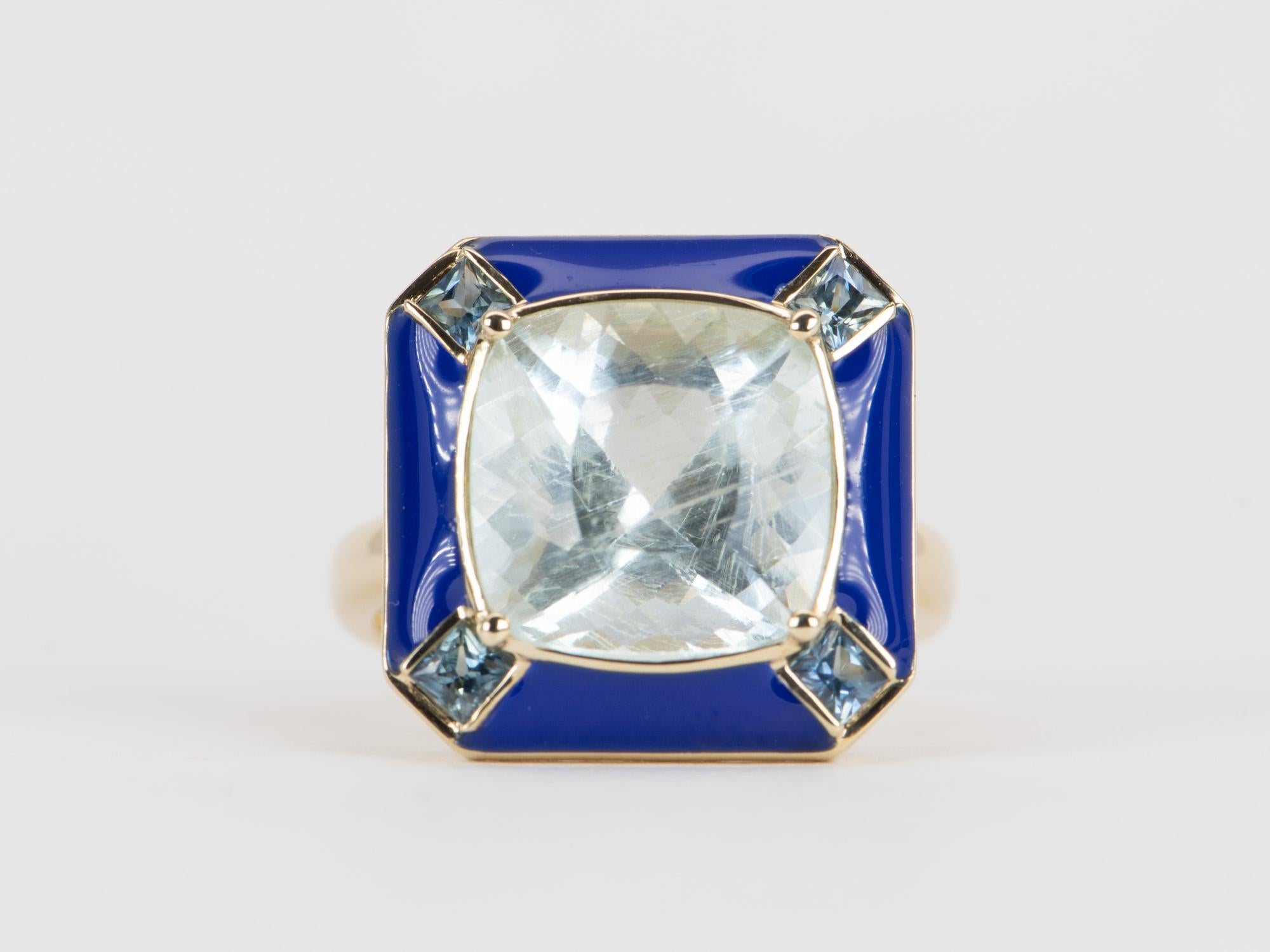 This exquisite statement ring is crafted with a unique 7.32ct Galaxy Aquamarine center and surrounded by a halo of teal sapphires and navy blue enamel. Set in 9K gold, this one-of-a-kind ring will be the perfect way to show your lasting commitment.