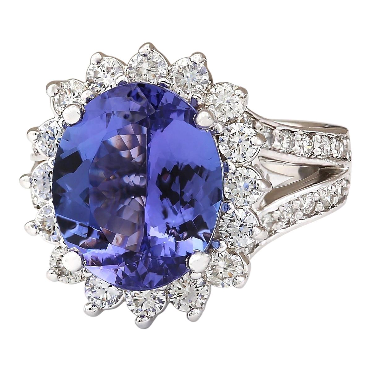 Indulge in timeless sophistication with our 7.33 Carat Tanzanite Ring, crafted in exquisite 14K White Gold. At its heart lies a captivating tanzanite, weighing 5.93 carats and measuring 13.00x11.00 mm. Accentuated by shimmering diamonds totaling