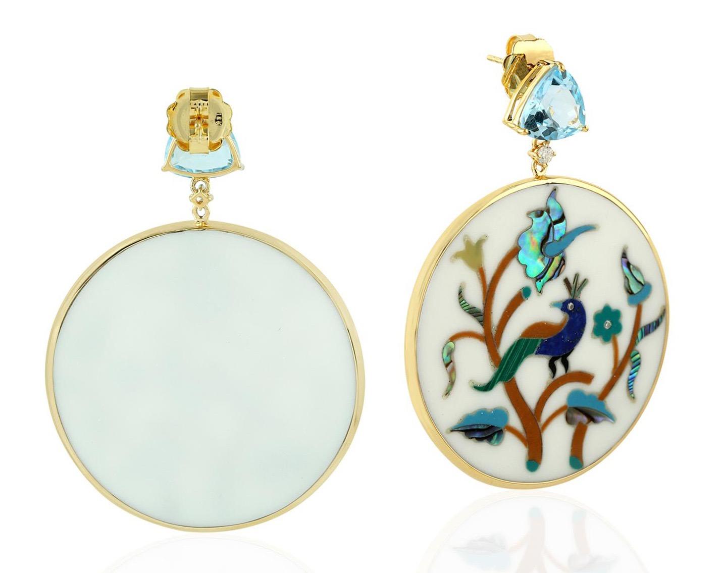 These beautiful peacock earrings features unique hand painted miniature art set with 18K gold, 61.69 carats bakelite, 7.35 carats blue topaz & 0.20 carats diamonds.

FOLLOW  MEGHNA JEWELS storefront to view the latest collection & exclusive pieces. 