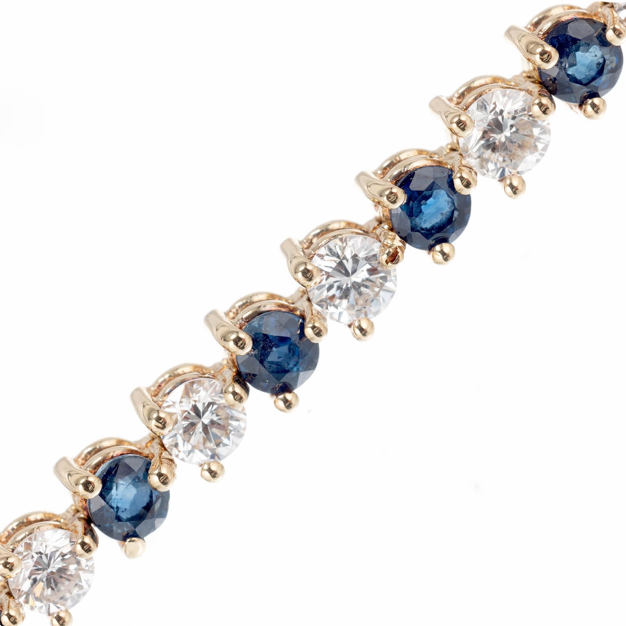 Sapphire and diamond link bracelet.  18k yellow gold,  three prong basket hinged link bracelet. 

21 Diamonds approx. total weight 4.20cts, H to I, VS1-VS2
21 Blue Sapphires approx. total weight 3.15cts
18k Yellow Gold
Stamped: 750 = 18k
12.6