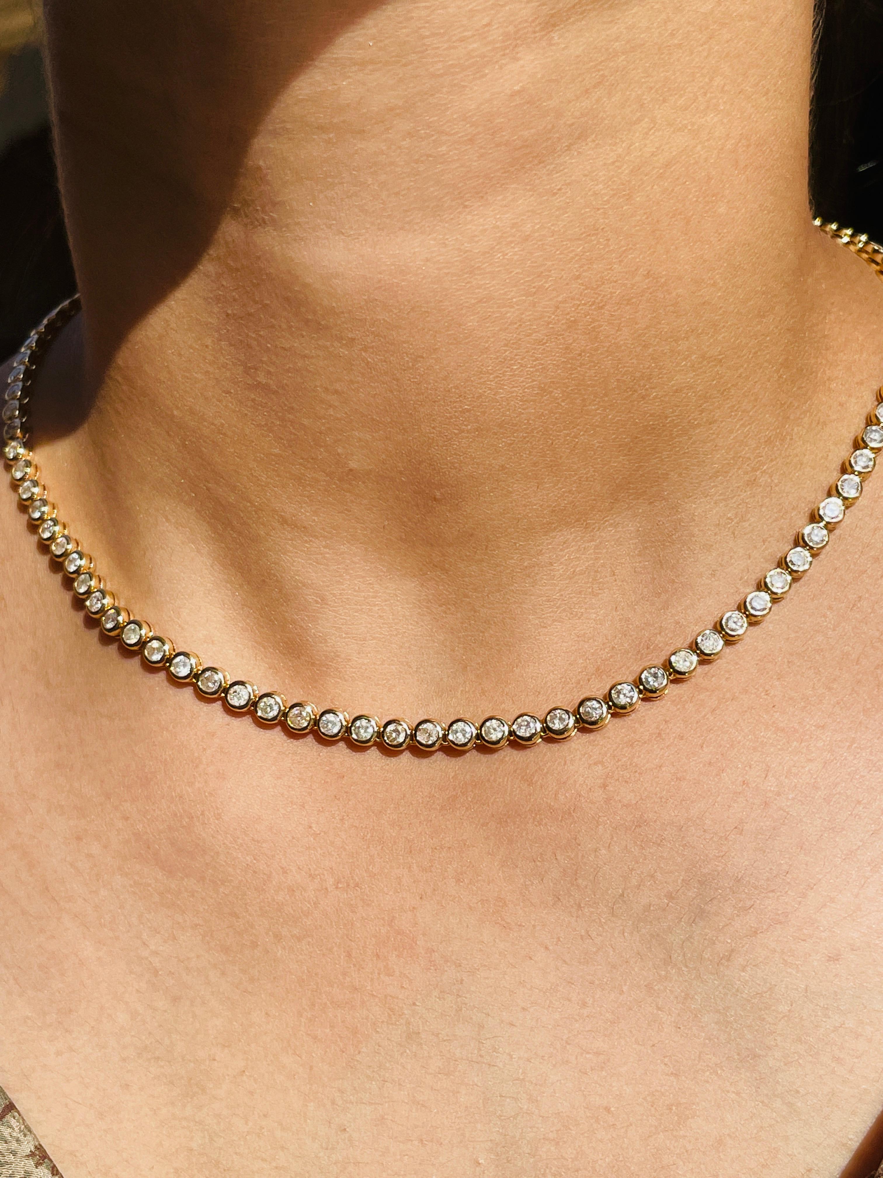 7.35 Carat Diamond Tennis Necklace in 18k Yellow Gold Gift for Women studded with round cut diamond of 7.35 carats. This stunning piece of jewelry instantly elevates a casual look or dressy outfit. 
April birthstone diamond brings love, fame,