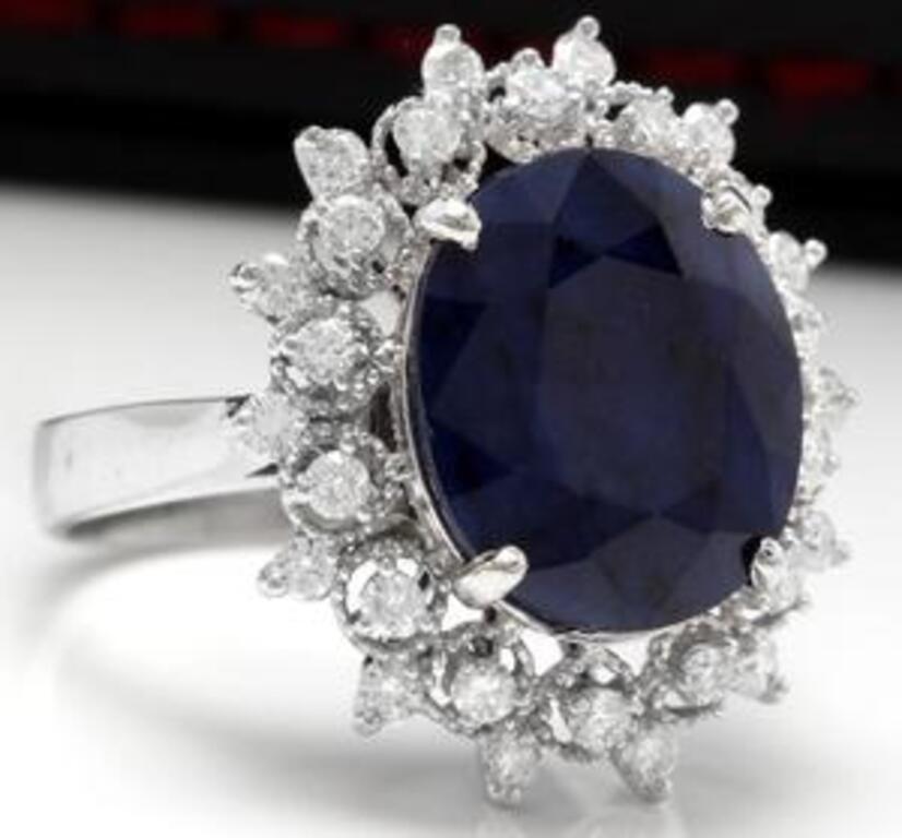7.35 Carats Exquisite Natural Blue Sapphire and Diamond 14K Solid White Gold Ring

Total Blue Sapphire Weight is: 6.50 Carats (Treated)

Sapphire Measures: 13 x 10mm

Natural Round Diamonds Weight: .85 Carats (color G-H / Clarity SI1-SI2)

Ring