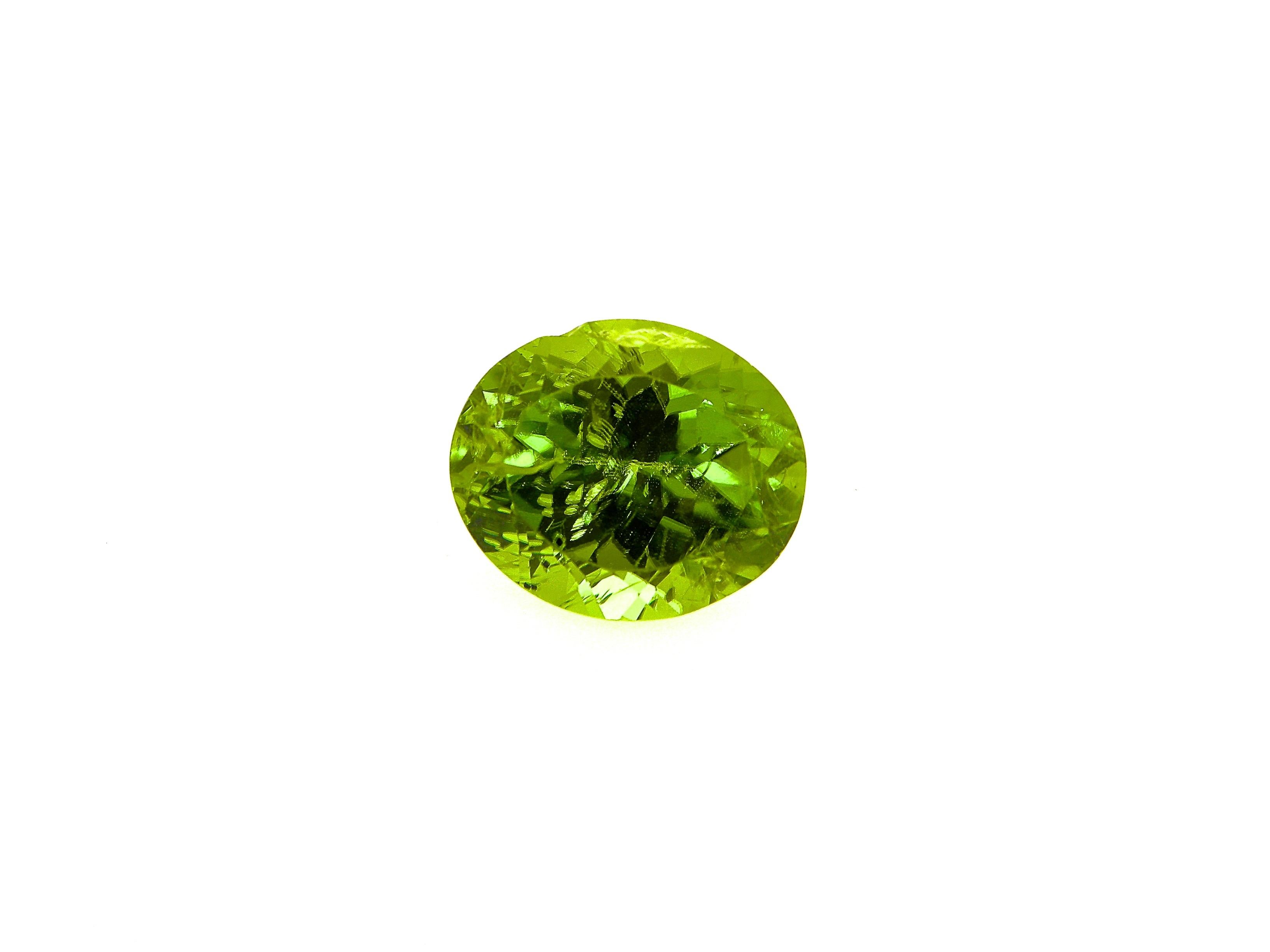 7.36 Carat Natural Unheated Oval-Cut Burmese Vivid Green Peridot:

A gorgeous gem, it is a 7.36 carat unheated oval-cut Burmese vivid green peridot. Hailing from the important Mogok mines in Burma, the peridot possesses a vivid green colour