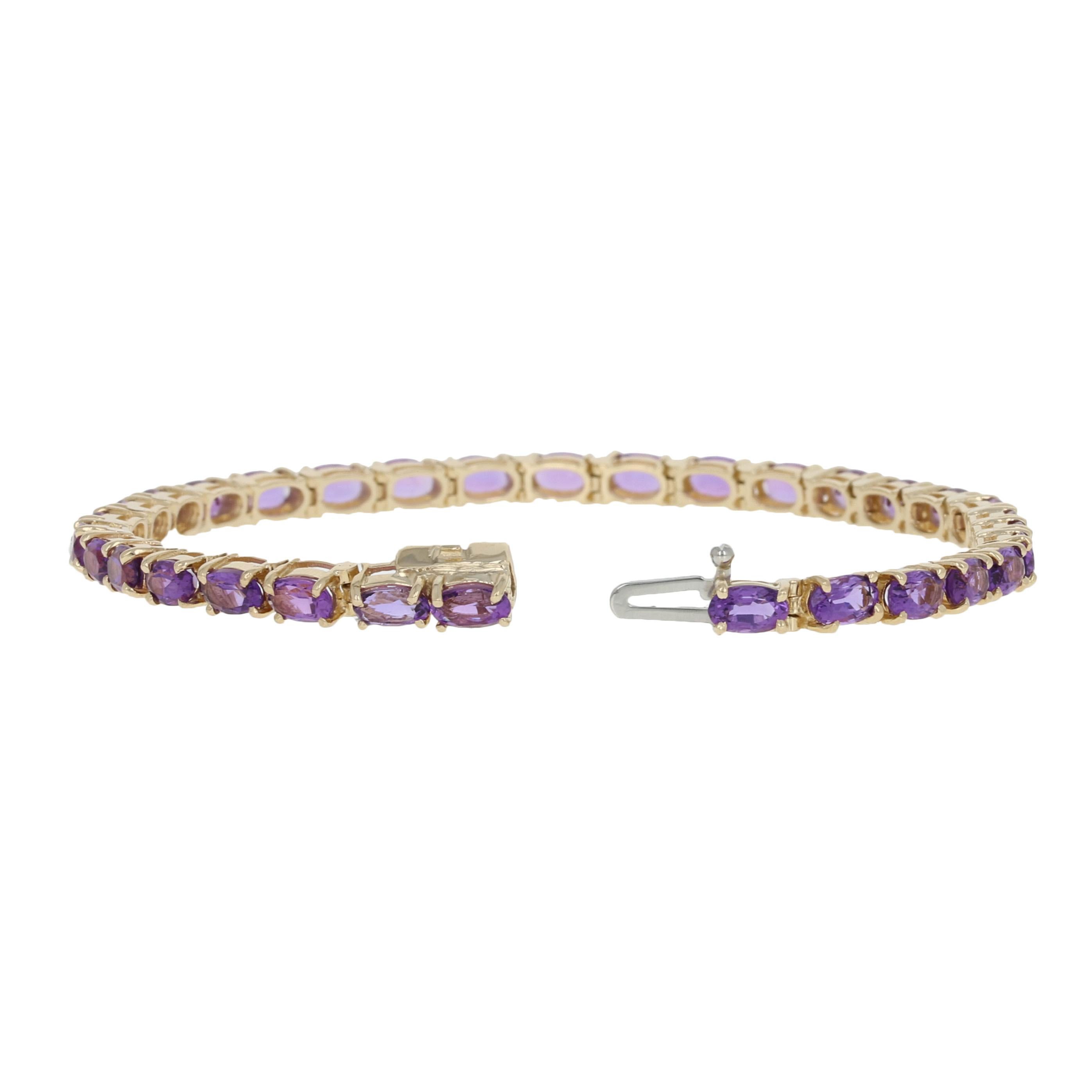 Fashioned in a sophisticated tennis style, this bracelet showcases silky purple amethysts set in glowing 14k yellow gold. 
 
 Metal Content: Guaranteed 14k Gold as stamped
 
 Stone Information:
 Genuine Amethysts - 
 Color: Purple 
 Cut: Oval 
