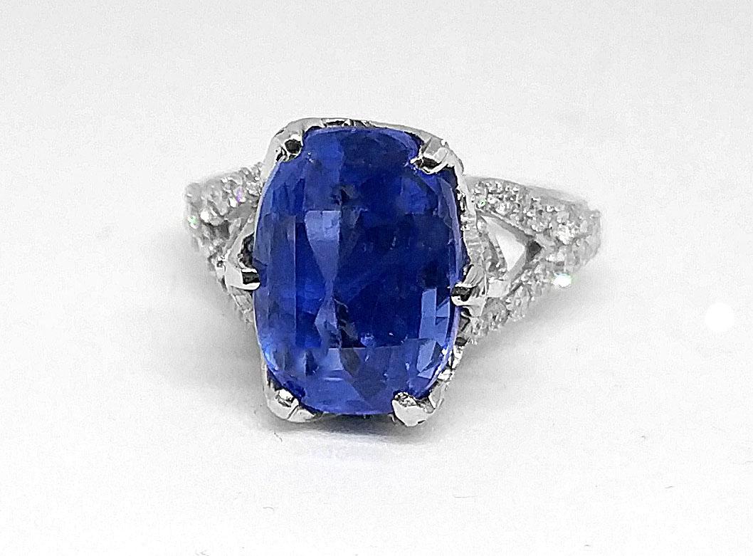 Hand crafted ring
7.37 carat natural untreated certified sapphire (old cut/ Prime origin/ vivid blue/ good transparency)
2 pear cut diamonds (J colour-SI clarity) of 0.65 carat each  (total 1.3 carats)
Additional 1.1 carat Diamonds 