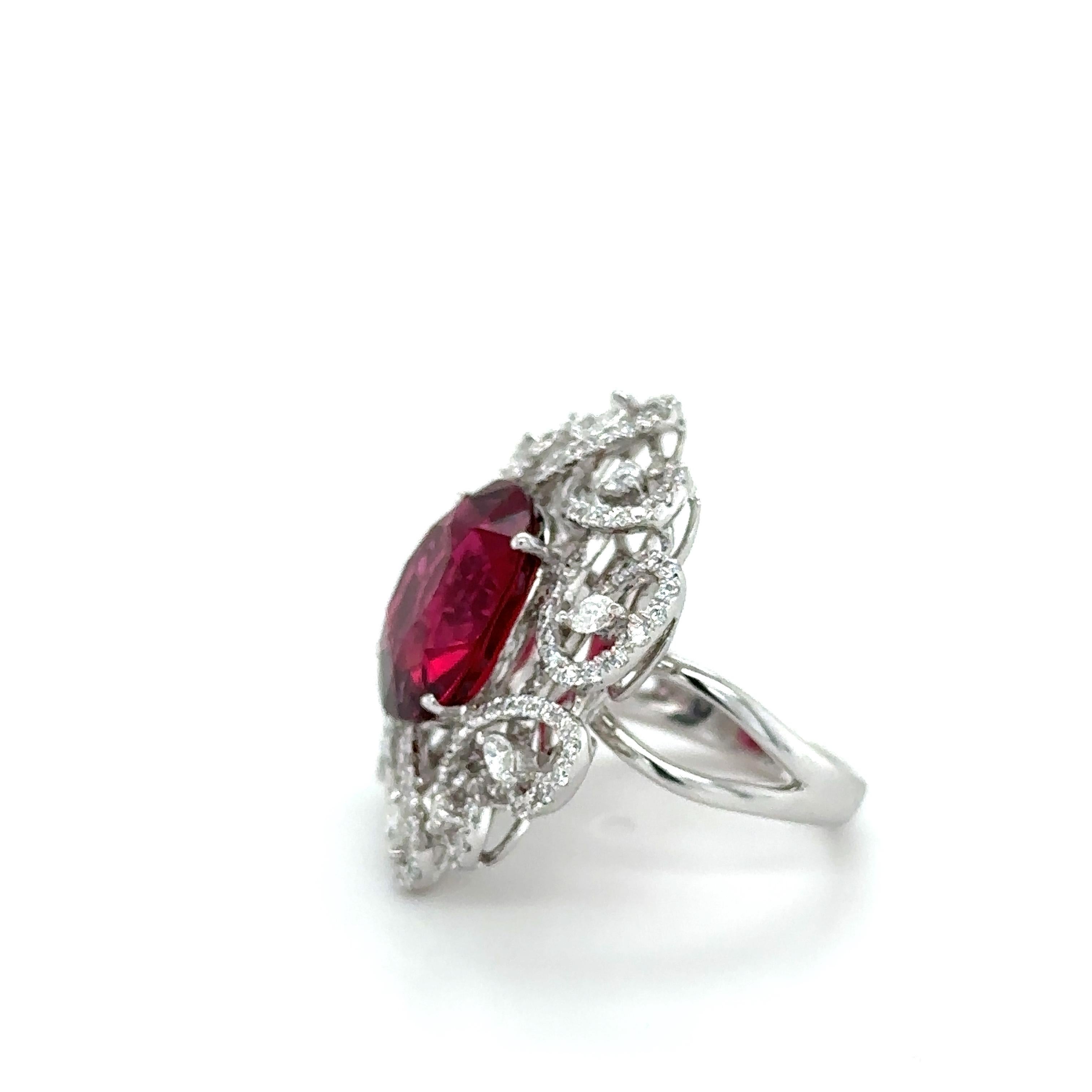This stunning rubelite diamond ring is a true masterpiece, crafted to create a breathtakingly beautiful piece of jewelry that is as unique as it is elegant. The centerpiece of this ring is an exquisite 7.37ct rubelite, a perfect shade of vivid
