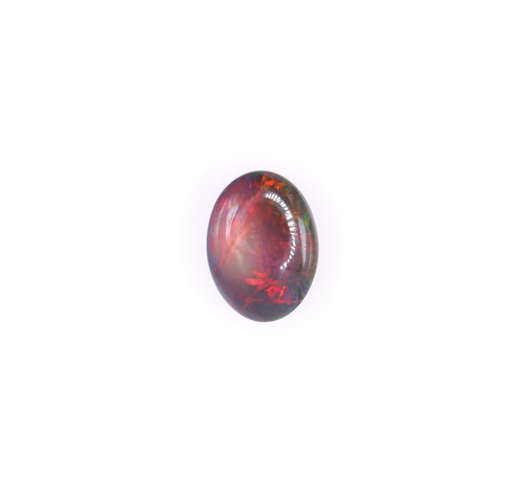 NNJ Designs presents a 7.38 carat loose Black Opal gemstone! Black Opal is often called the 