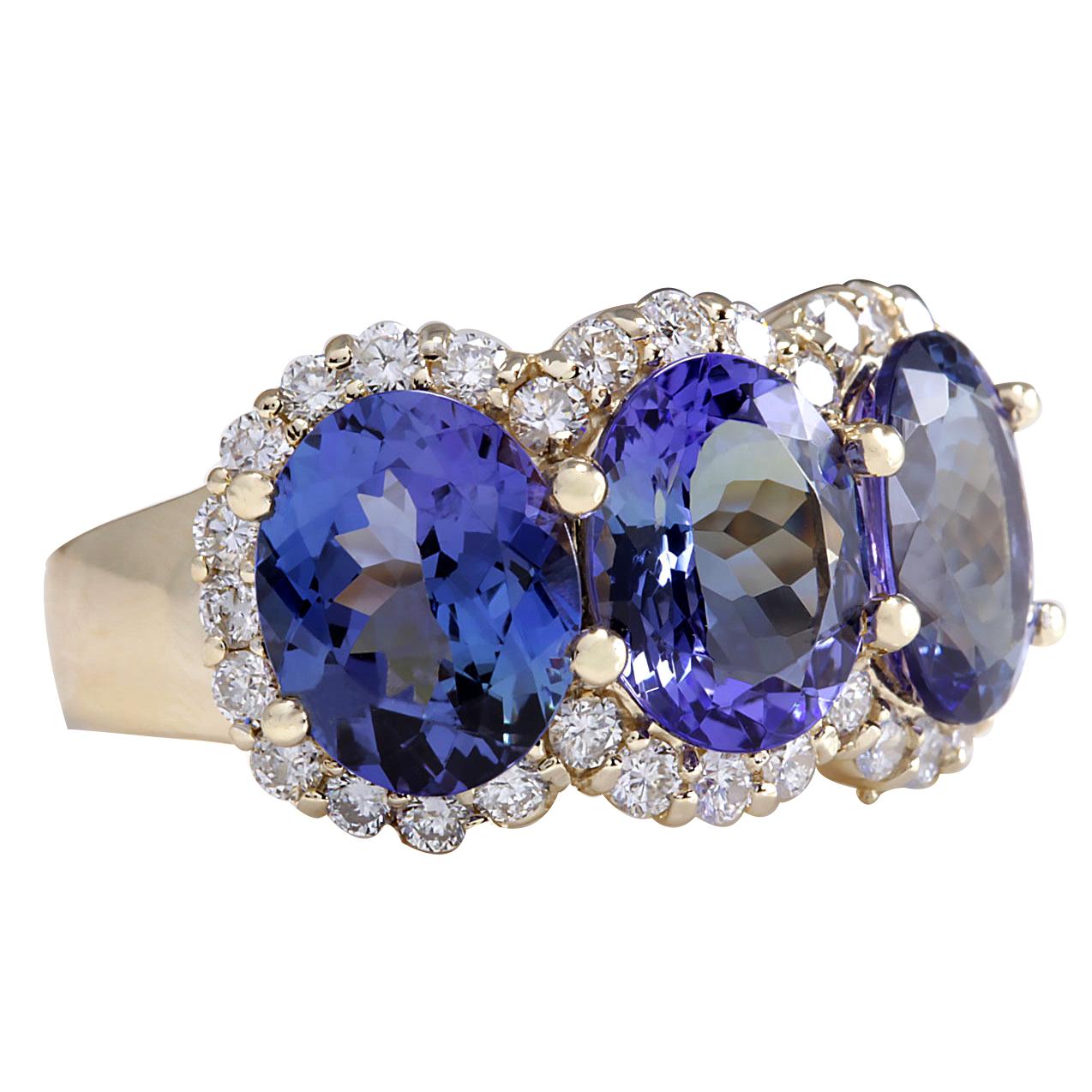 7.38 Carat Tanzanite 14 Karat Yellow Gold Diamond Ring
Stamped: 14K Yellow Gold
Total Ring Weight: 7.8 Grams
Total  Tanzanite Weight is 6.58 Carat (Measures: 9.00x7.00 mm)
Color: Blue
Total  Diamond Weight is 0.80 Carat
Color: F-G, Clarity: