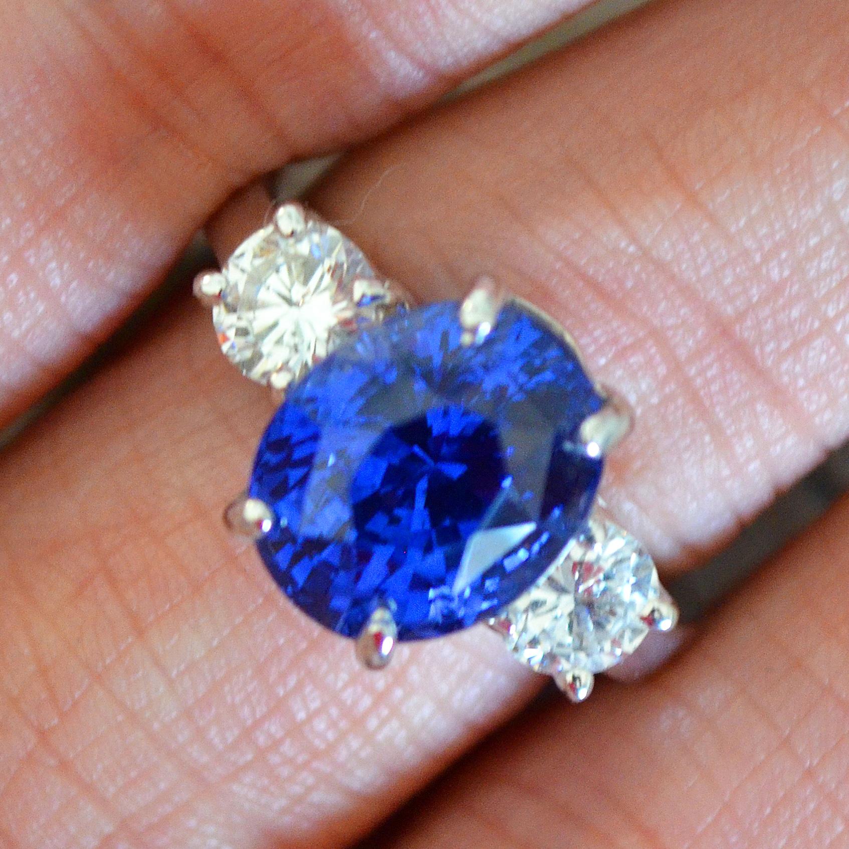 Oval Cut 7.39 Carat Blue Sapphire 3-Stone Diamond Ring For Sale