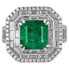 7.39tcw 18K White Gold Emerald & Triple Diamond Halo Statement Engagement Ring