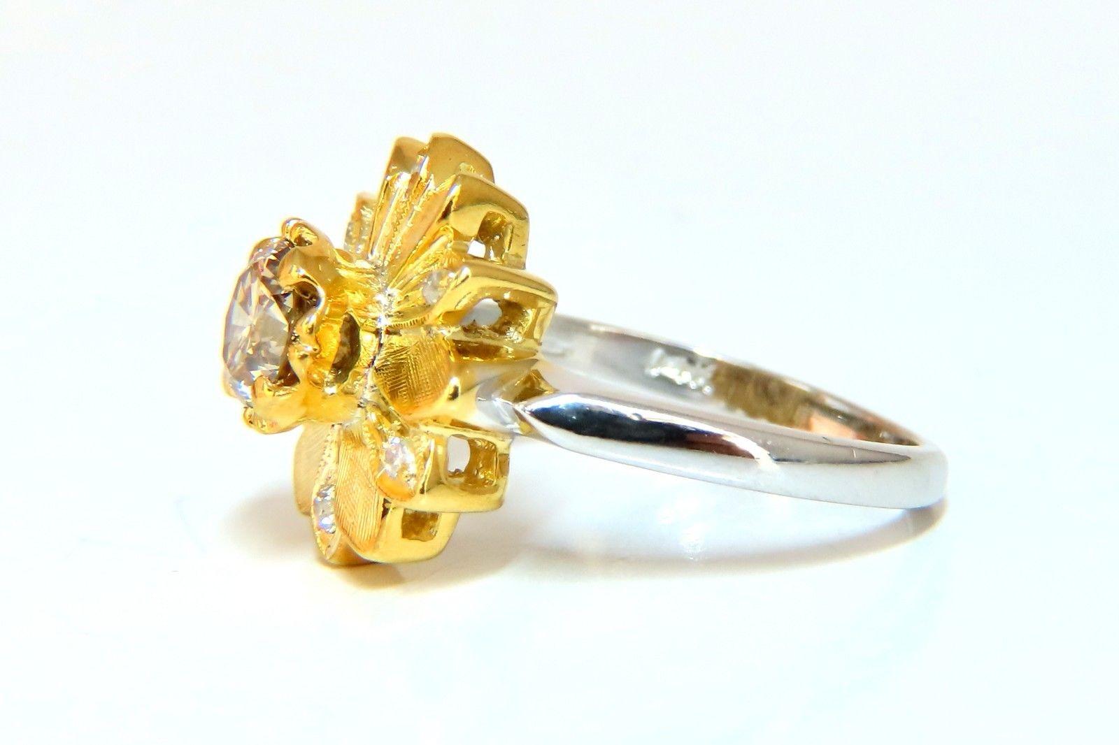 Petite Petals & Blossom

.63ct. Natural Fancy Orange brown round brilliant diamond ring.

Vs-2 clarity and full cut.

Side diamonds: .10ct. 

H-color, Vs-2 clarity.

14kt. white & yellow  gold

Top deck: 14 mm wide 

Depth: 7.0mm

4.2