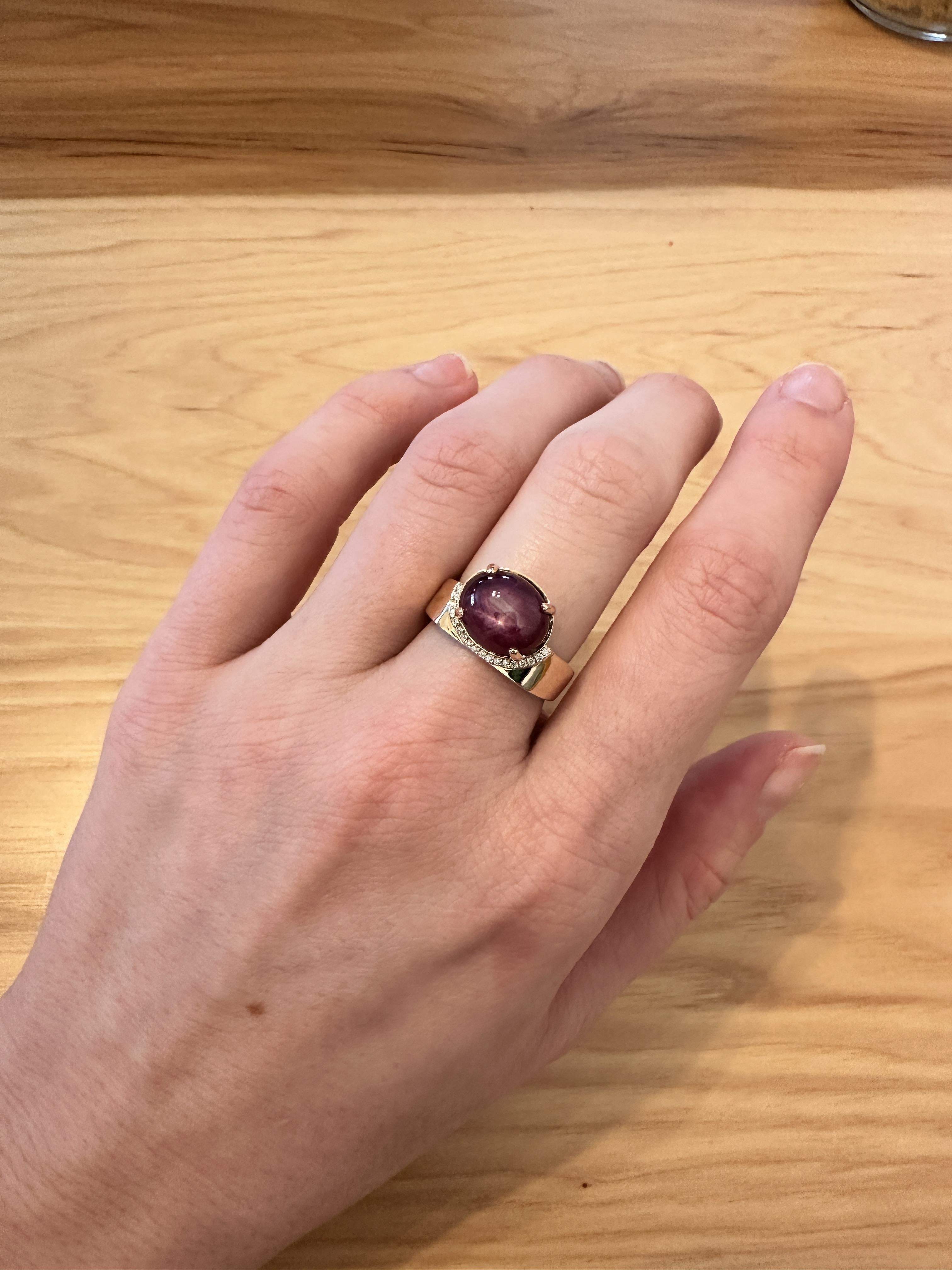 This lovely 7.33 carat star ruby ring is made in solid 14k gold with natural earth mined diamonds in solid 14k gold. This piece is statement and classy. Its sturdy broad band allows worry-free wear. This ring can be a beautiful July birthstone gift