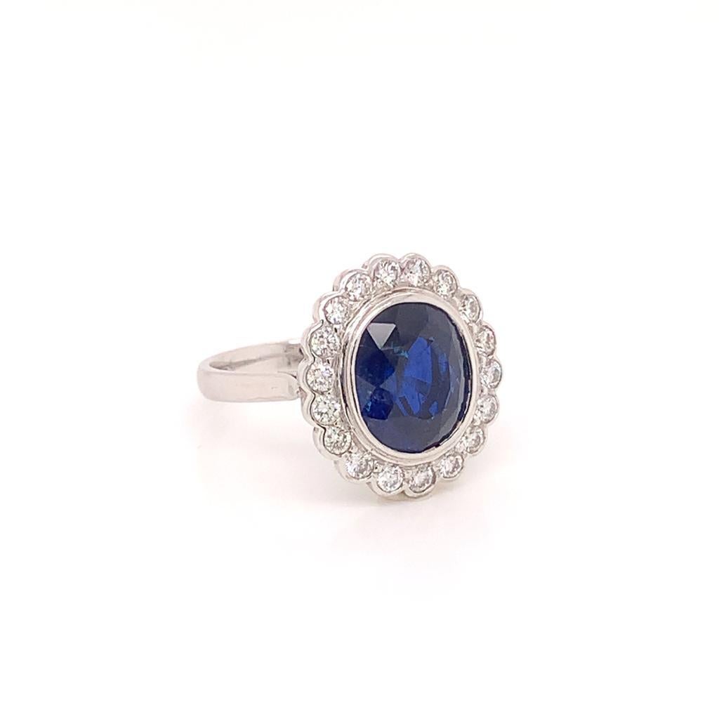 The centrepiece of this elegant ring is a stunning Semi-Oval Blue Sapphire weighing approximately 7.40 Carats. This jewel speaks for itself with its rich, royal hues, and is set in a befitting, expertly handcrafted, 18K White Gold band. This stone