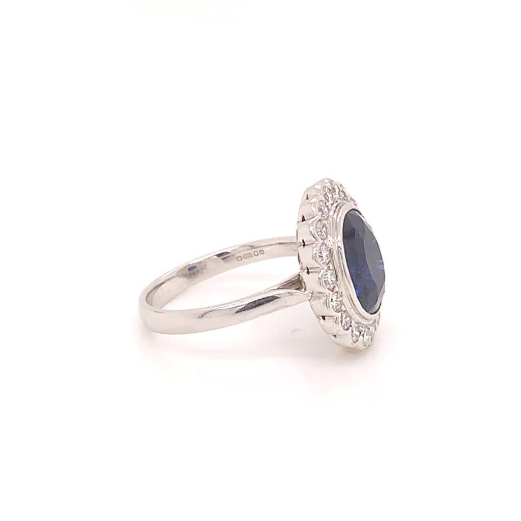 Oval Cut 7.4 Carat Semi-Oval Blue Sapphire and Diamond Cluster Ring in 18k White Gold For Sale