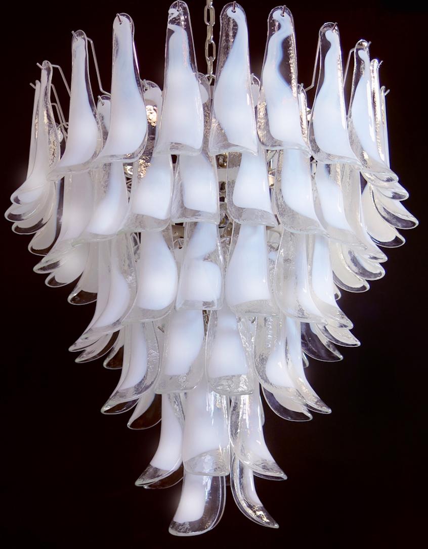 Handblown glass chandelier, composed by 74 glass petals (transparent and white “lattimo”) in a chrome frame. Available in different colors!
Dimensions: 65 inches (165 cm) height with chain; 37.40 inches (95 cm) height without chain; 31.50 inches