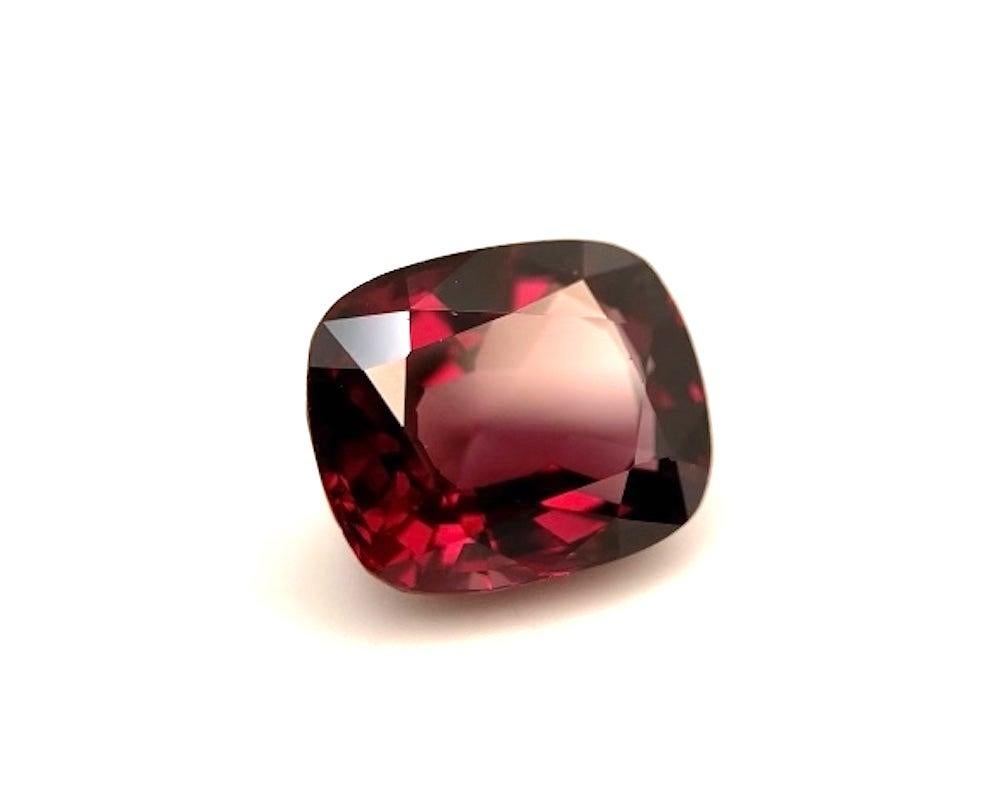 This richly colored rhodolite garnet has beautiful a deep burgundy hue and is a lovely rounded cushion shape. With such rich red color and exceptional clarity, this gem would make a beautiful piece of jewelry! It measures 12.21 x 10.09 x 6.57