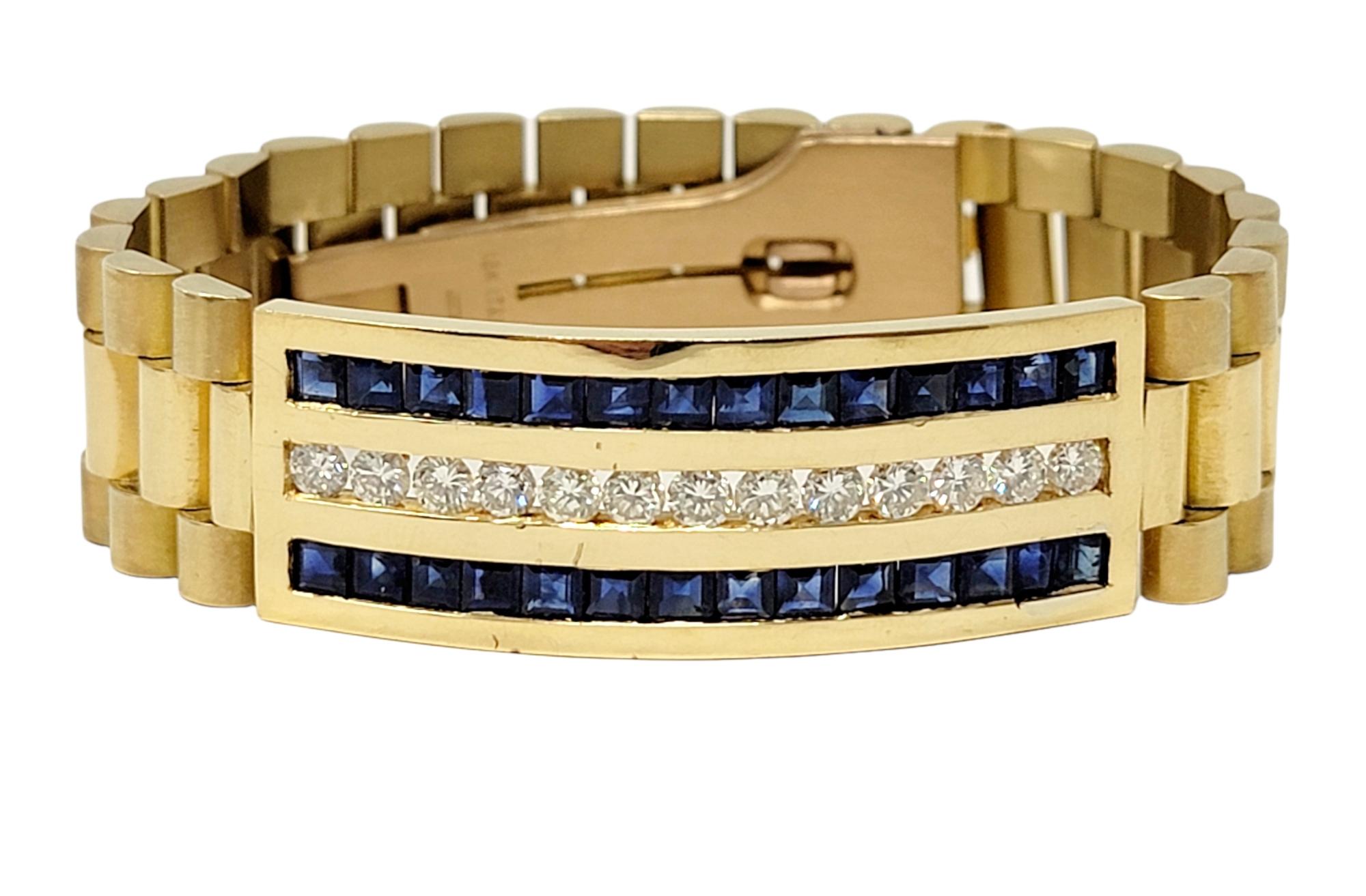 This eye-catching mens diamond and sapphire 18 karat yellow gold watch link bracelet makes a bold and luxurious statement. The contemporary design of this impressive piece looks handsome on the wrist, really drawing the viewers attention to the