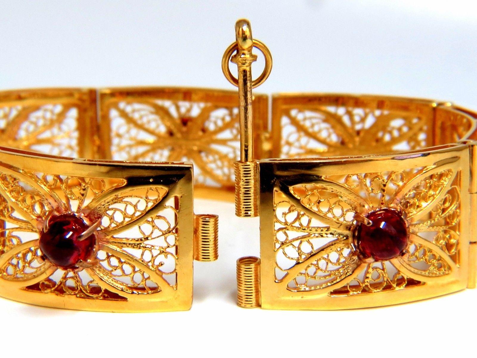 7.40ct. Natural Cabochon Spinels bracelet.

Vintage Open Gilt Design

Vivid Red colors.

Transparent & Clean Clarity.

 Average 5.7mm

No Enhancements & Fully Natural.

14kt. Yellow gold 

37 Grams.

5.5mm wide bracelet

7.25 inches long (wearable