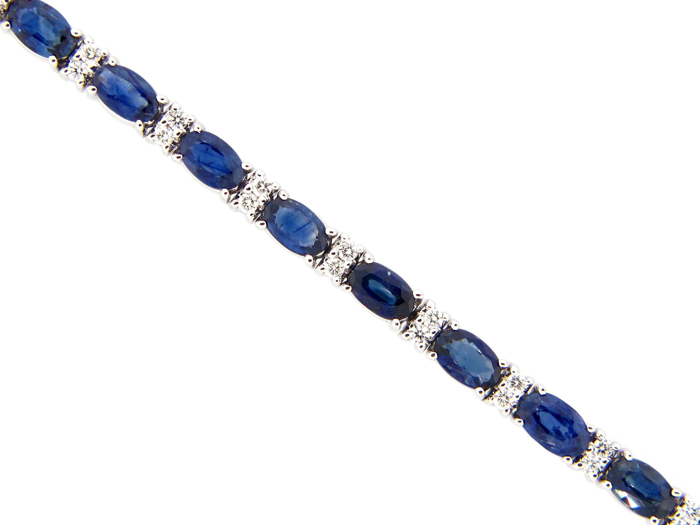 This stunning Sapphire and Diamond Bracelet features 24 beautiful Oval Sapphires, each separated by set of 2 Radiant Round White Diamonds. This Bracelet is set in 14k White Gold —  is 6 3/4 inches in length and is secured with a box clasp.
Total