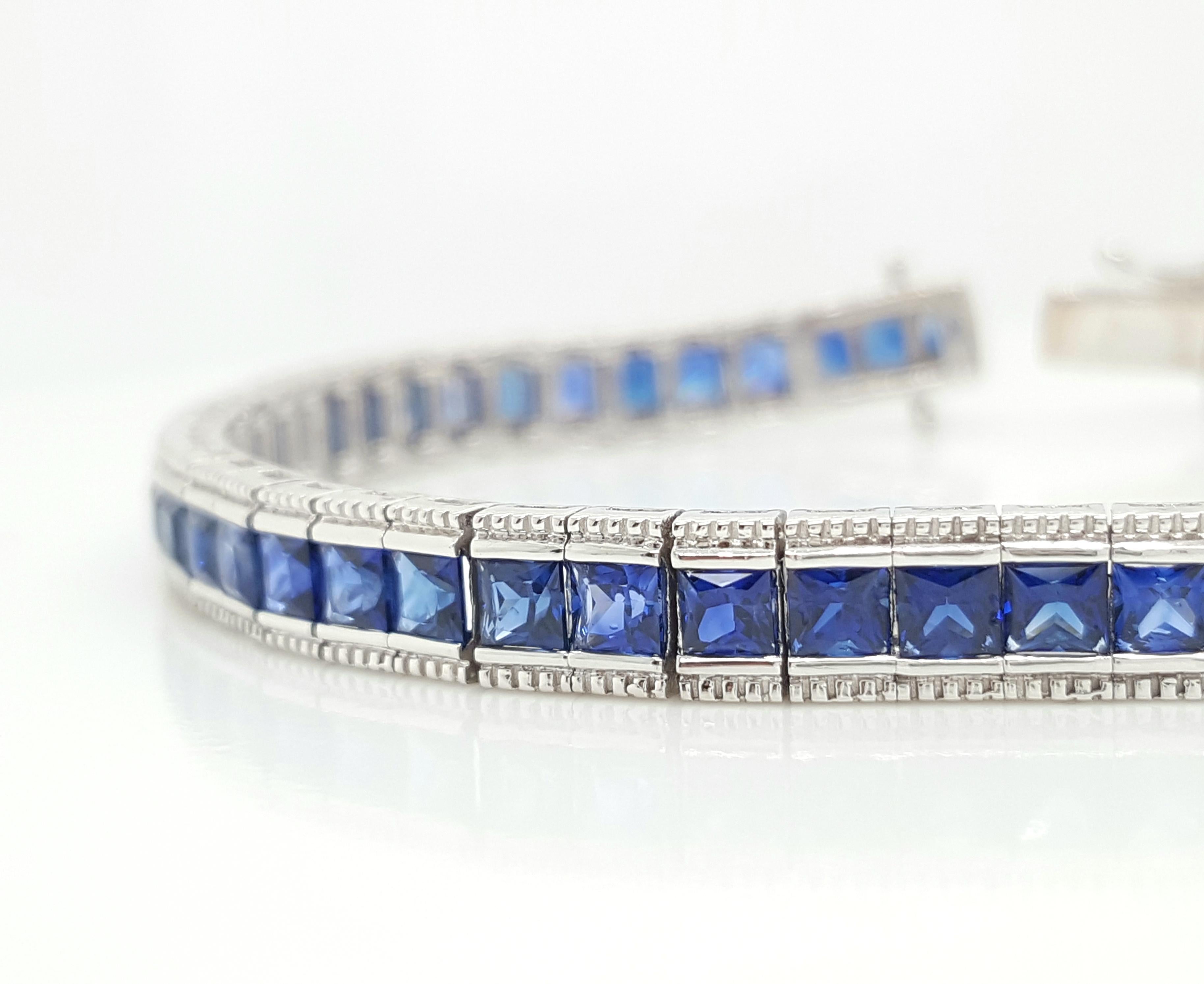 This incredible tennis bracelet is an absolute beauty. It is flowing with 7.40 carats of square, natural  bright royal blue sapphires . The bracelet is made of 18 karat white gold and sits on the the arm perfectly with flexibility. This bracelet is