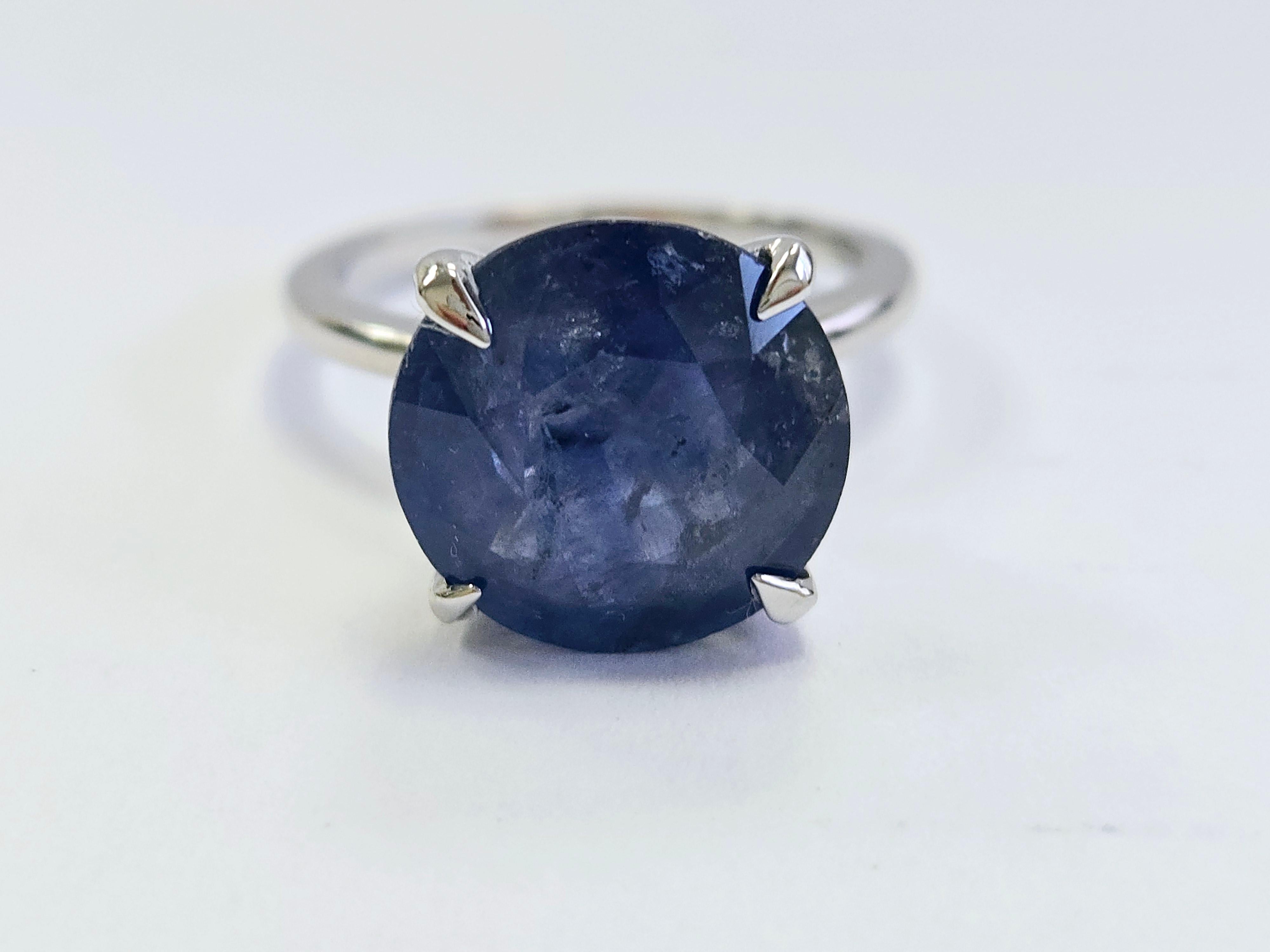 Exquisite 7.40 Carat Round Shape Natural Sapphire Ring in 14K White Gold

Indulge in the brilliance of this remarkable natural sapphire ring, featuring a stunning 7.40 -carat round sapphire set in a luxurious 14K white gold band. The vibrant blue