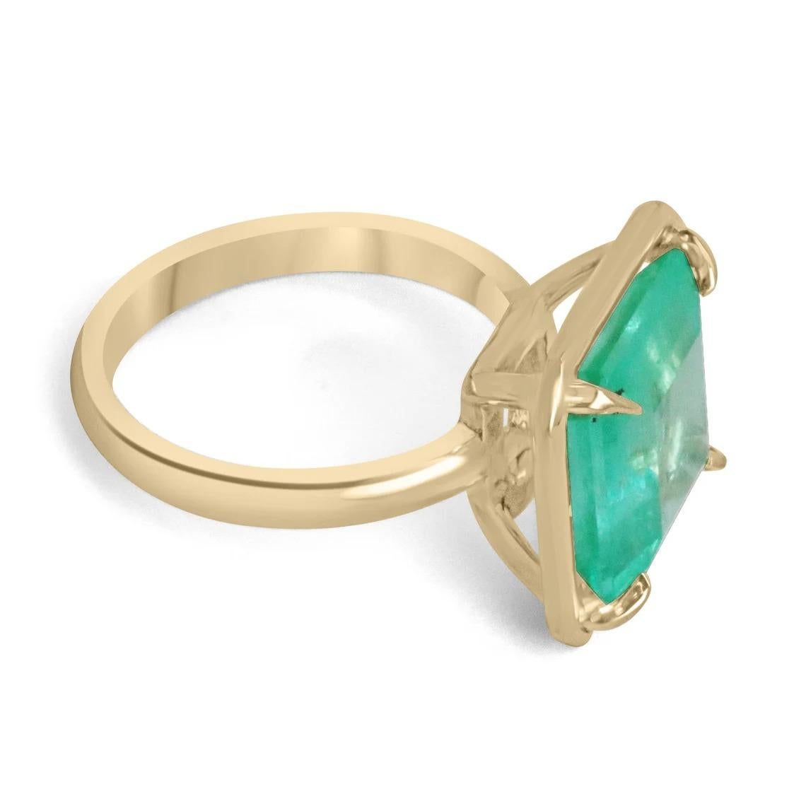 A simple, yet dramatic solitaire emerald ring. This gorgeous piece showcases a very large 7.40-carat, natural Colombian emerald in the cut of an asscher. With a gemstone this size, it is very rare to find a stone that displays such impressive and