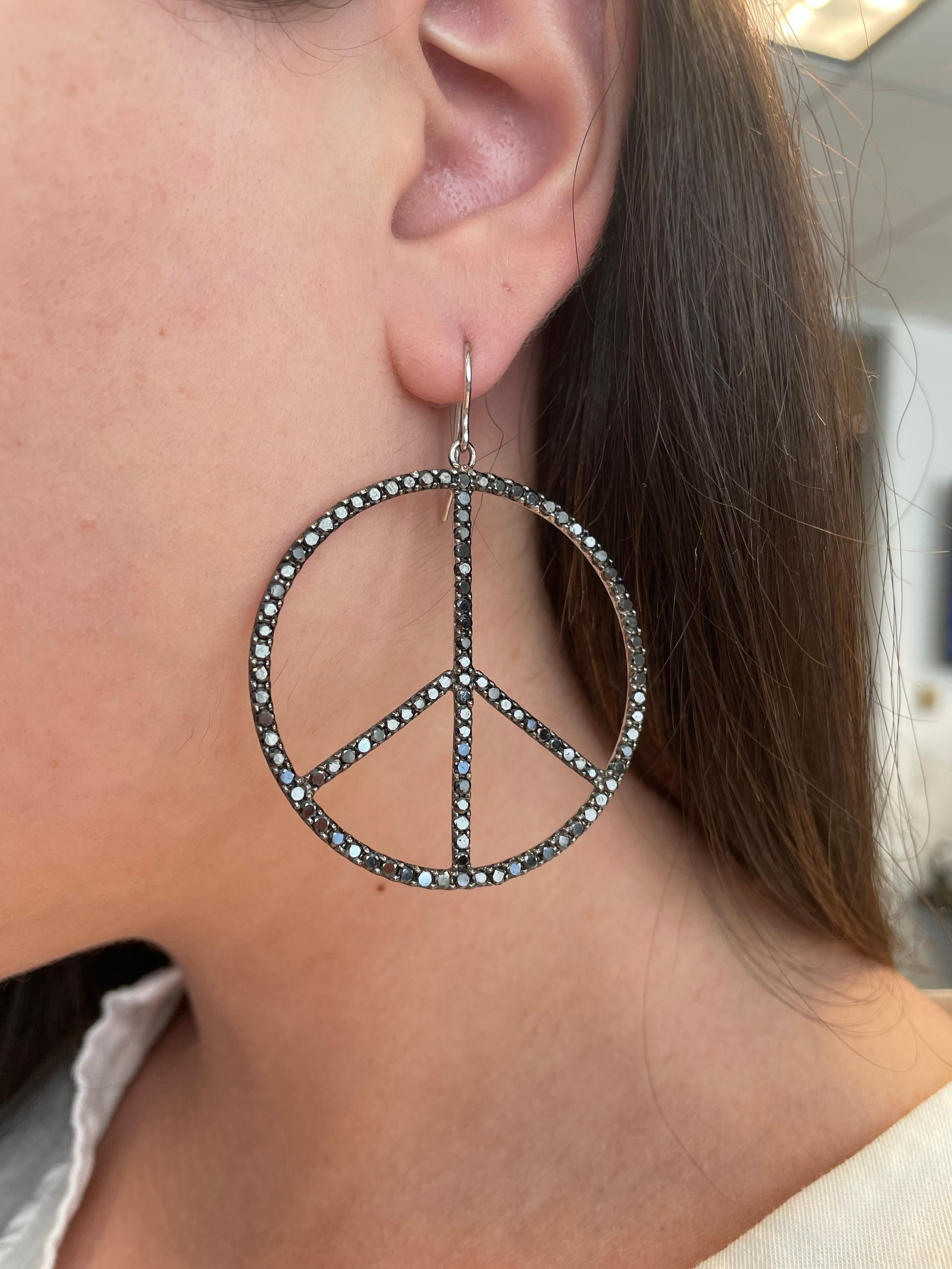 Statement black diamond peace sign earrings.
7.40ct of round black diamonds, 18-karat white gold. 
Accommodated with an up to date appraisal by a GIA G.G. upon request. Please contact us with any questions.

Item number
E3404