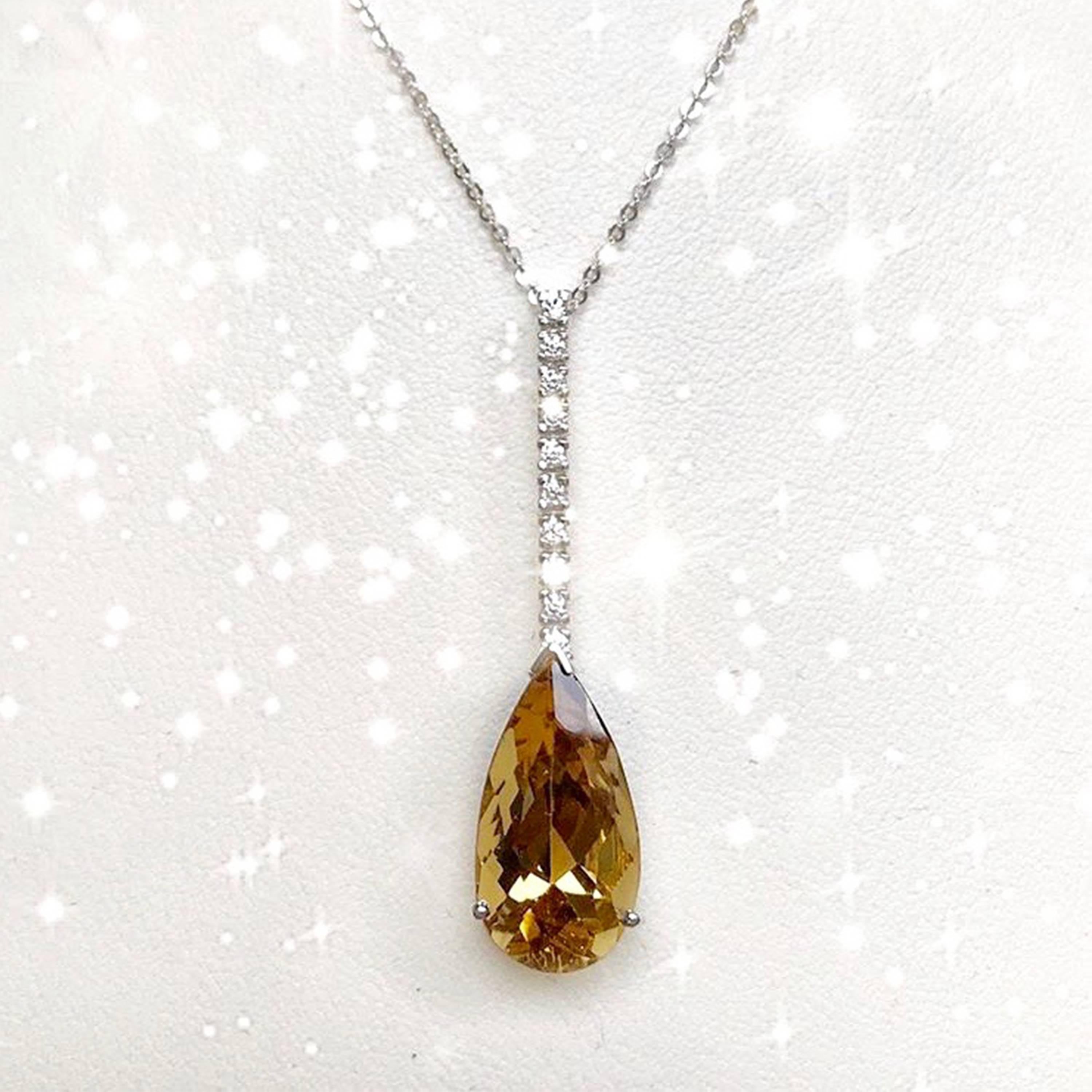 Material: 14k White Gold 
Center Stone Details: 7.41 Carat Pear Shaped Yellow Beryl - 18 x 10 mm
Diamonds:  10 Round Diamonds at 0.15 Carats.  SI Quality /  H-I Color
Chain:  18 Inch
Fine one-of-a kind craftsmanship meets incredible quality in this