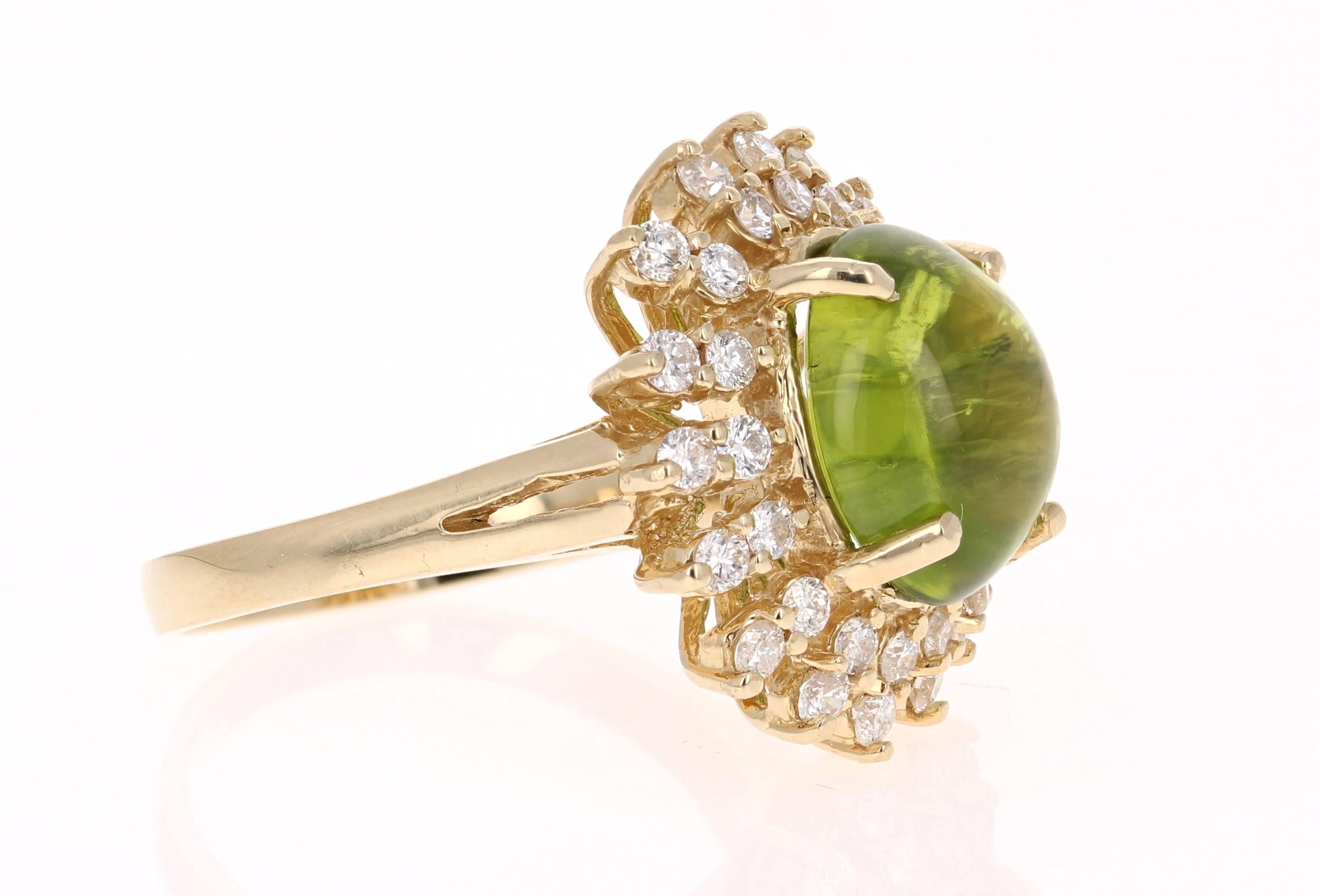 Gorgeous and Unique is an understatement. This beautiful Cabochon Cut Peridot is 6.52 Carats surrounded by a graceful design of 32 Round Cut Diamonds weighing 0.90 Carats. The clarity and color of the diamonds are SI1-F. The total carat weight of