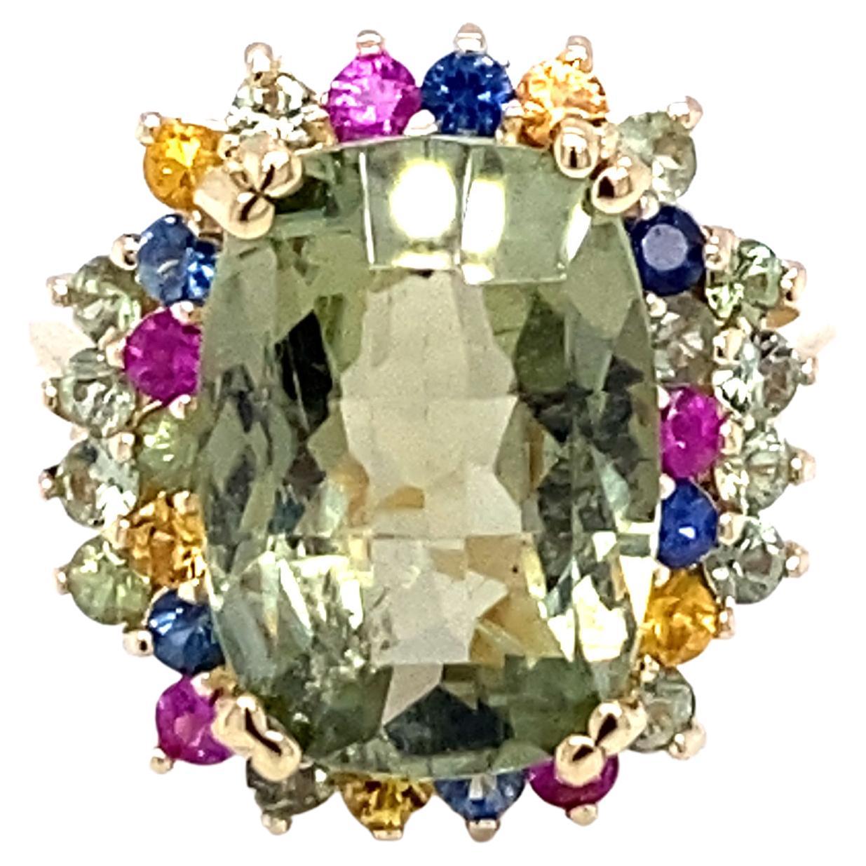 7.42 Carat Tourmaline Multi-Sapphire Yellow Gold Cocktail Ring

This Ring has a Cushion Checkered Cut Green Tourmaline that weighs 6.09 Carats and 32 Multi Sapphires that weigh 1.33 Carats. 
The Total Carat Weight of the Ring is 7.42 Carats. 
This