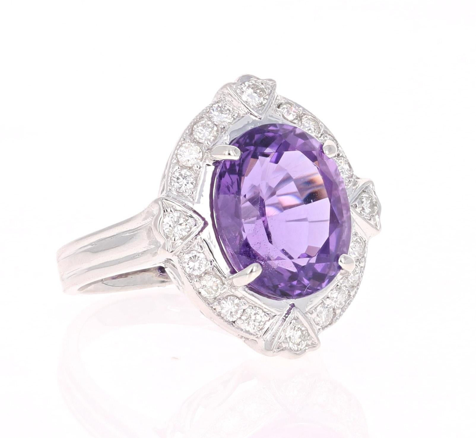 This beautiful ring has a 6.82 carat Oval Cut Amethyst set in the center and is surrounded by 20 Round Cut Diamonds that weigh 0.61 carats.  The total weight of the ring is 7.43 carats.  

The ring is made in 14K White Gold and weighs approximately